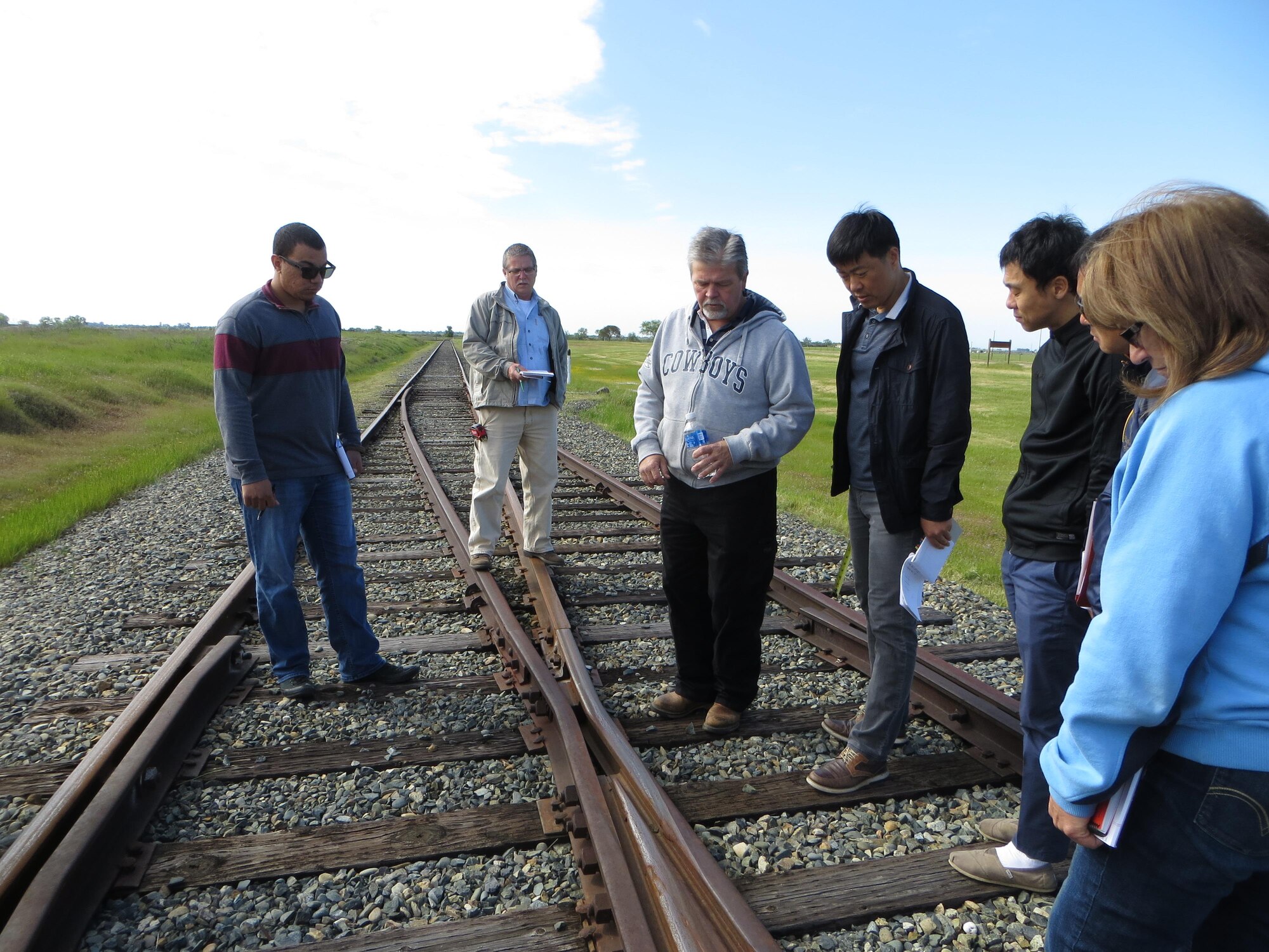 At center, Mike Crawford, chief track inspector at the U.S. Army Engineering Research and Development Center, explains different turnout components to a group of students during a field trip. A turnout, also known as a railroad switch, is a section of track designed to divert trains from one track to another. The asset visibility transportation division of the Air Force Civil Engineer Center's Operations Directorate recently funded and organized a Certified Railroad Inspector training course at Beale Air Force Base, California.(Courtesy Photo)