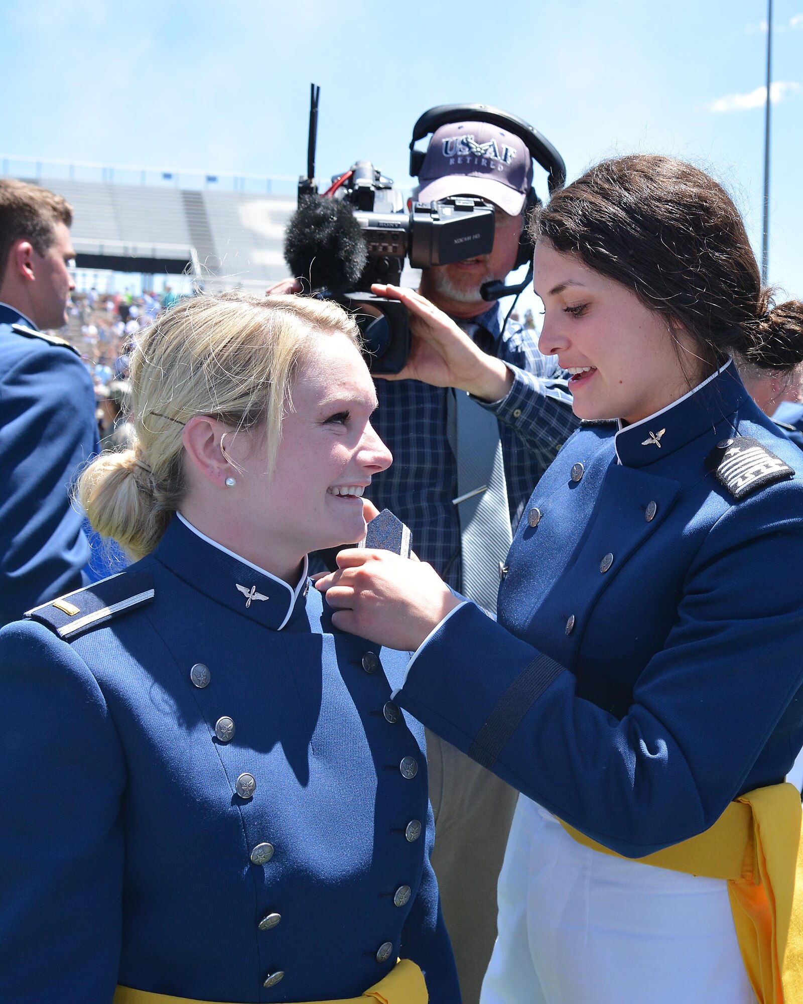 Newly-commissioned Air Force second lieutenants pin on their officer's rank at the end of the Class of 2017's graduation ceremony, May 24, 2017, at the U.S. Air Force Academy. (U.S. Air Force photo/Darcie Ibidapo)