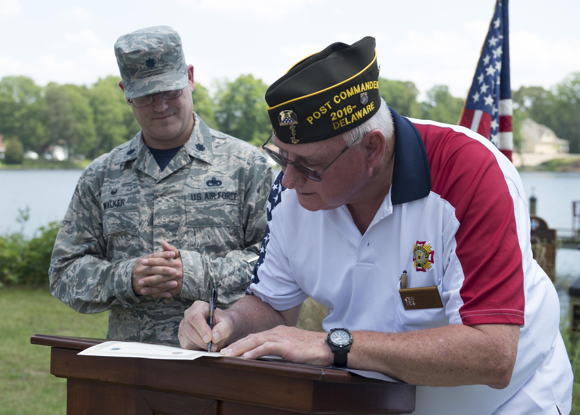 Ed Moczulski, Veterans of Foreign Wars Post 6483 commander, signs an agreement that formally adopts the 436th Logistics Readiness Squadron under the VFW’s Adopt a Unit Program May 19, 2017, in Milford, Del. This adoption was organized by Tech. Sgt. Steven Hall, 436th LRS vehicle management, who is a member of both the LRS and VFW Post 6483. (U.S. Air Force photo by Senior Airman Zachary Cacicia)