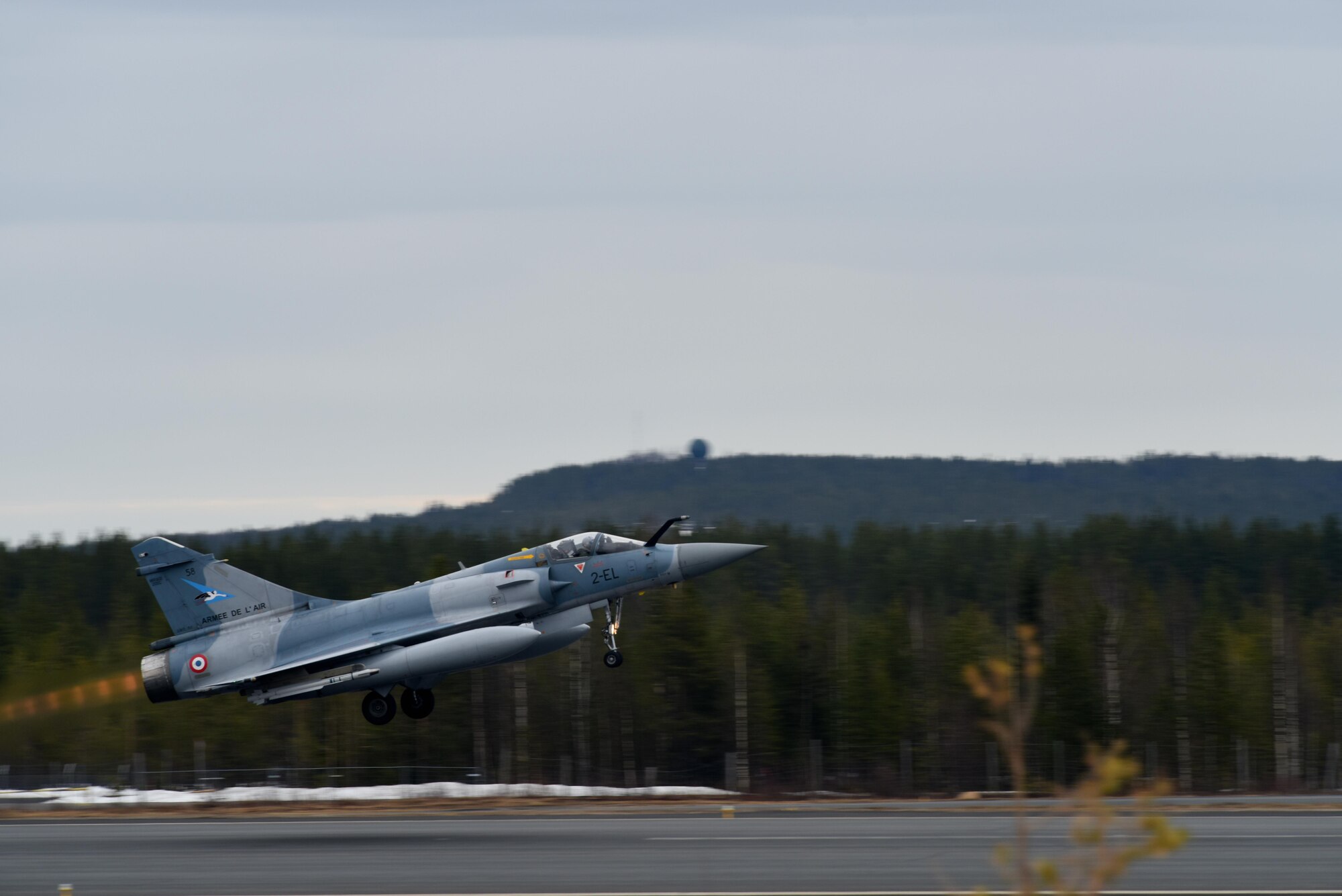 A French Mirage 2000 takes off at Rovaniemi Air Base, Finland, May 22, in support of Arctic Challenge 2017. Continued, realistic interoperability exercises, such as ACE 17, allow the U.S., allies and partner nations to build their expertise in the air. (U.S. Air Force photo/Airman 1st Class Abby L. Finkel)