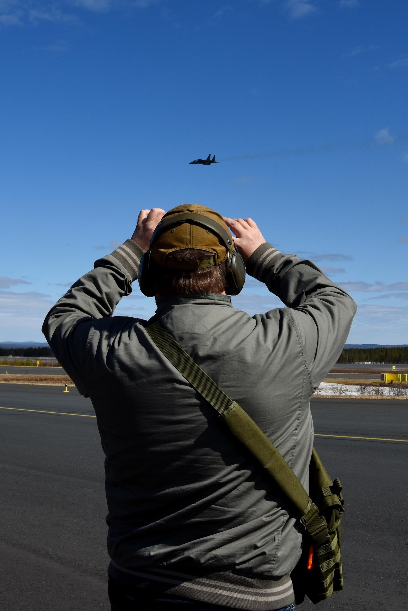 A media representative takes a photo of an aircraft during the Arctic Challenge 2017 media day at Rovaniemi Air Base, Finland, May 23. Media representatives from multiple nations gathered to learn about the exercise, which is aimed at strengthening partnerships between participating armed forces. (U.S. Air Force photo/Airman 1st Class Abby L. Finkel)