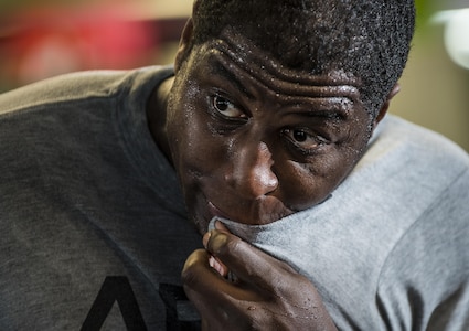 Spc. Coulter Brandon, a U.S. Army Reserve Soldier from the 200th Military Police Command, wipes sweat from his face during a Zumba fitness session as part of a Performance Triad program organized by the command and hosted on Fort Meade, Maryland, May 9, 2017. The three-week fitness program took place from May 5-25 to help Soldiers who had either failed the Army Physical Fitness Test or had been on the Army Body Fat Composition program. The camp focused on the triad of overall health: physical fitness, nutrition and sleep, by providing education and personalized coaching to Soldiers in all three of those phases of life and more. (U.S. Army Reserve photo by Master Sgt. Michel Sauret)