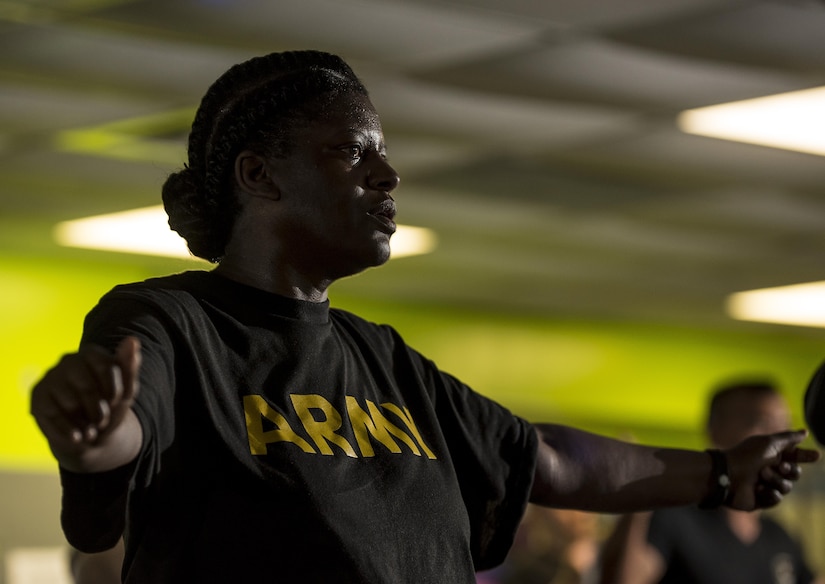 Sgt. 1st Class Karen Goodwin, a U.S. Army Reserve Soldier from the 200th Military Police Command, participates in a Zumba fitness class during a Performance Triad program organized by the command and hosted on Fort Meade, Maryland, May 9, 2017. The three-week fitness program took place from May 5-25 to help Soldiers who had either failed the Army Physical Fitness Test or had been on the Army Body Fat Composition program. The camp focused on the triad of overall health: physical fitness, nutrition and sleep, by providing education and personalized coaching to Soldiers in all three of those phases of life and more. (U.S. Army Reserve photo by Master Sgt. Michel Sauret)