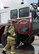 U.S. Air Force Staff Sgt. Joseph Baronak, 7th Civil Engineer Squadron Fire Prevention craftsman, dons the necessary protective equipment during a group-training exercise at Dyess Air Force Base, Texas, May 22, 2017. Firefighters are required to wear a fire-retardant suit as well as a breathing apparatus which provides oxygen while working in smoke-filled areas. (U.S. Air Force photo by Airman 1st Class Katherine Miller)