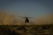 A CH-47 Chinook helicopter lands to pick up personnel during Angel Thunder 17 at Gila Bend, Ariz., May 13, 2017. Angel Thunder is a two-week, Air Combat Command-sponsored, joint certified and accredited personnel recovery exercise focused on search and rescue. The exercise is designed to provide training for personnel recovery assets using a variety of scenarios to simulate deployment conditions and contingencies. (U.S. Air Force photo by Staff Sgt. Corey Hook)