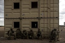 U.S. Air Force and international partners stack on the side of the building at Florence, Ariz., during Angel Thunder 17, May 9, 2017. Angel Thunder is a two-week, Air Combat Command-sponsored, joint certified and accredited personnel recovery exercise focused on search and rescue. The exercise is designed to provide training for personnel recovery assets using a variety of scenarios to simulate deployment conditions and contingencies. (U.S. Air Force photo by Staff Sgt. Corey Hook)