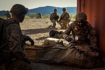 Royal Danish Air Force forward aeromedical evacuation technicians from the 660th Forward Support Squadron treat a simulated patient during a personnel recovery mission during Angel Thunder 17 at Gila Bend, Ariz., May 13, 2017. Angel Thunder is a two-week, Air Combat Command-sponsored, joint certified and accredited personnel recovery exercise focused on search and rescue. The exercise is designed to provide training for personnel recovery assets using a variety of scenarios to simulate deployment conditions and contingencies. (U.S. Air Force photo by Staff Sgt. Corey Hook)