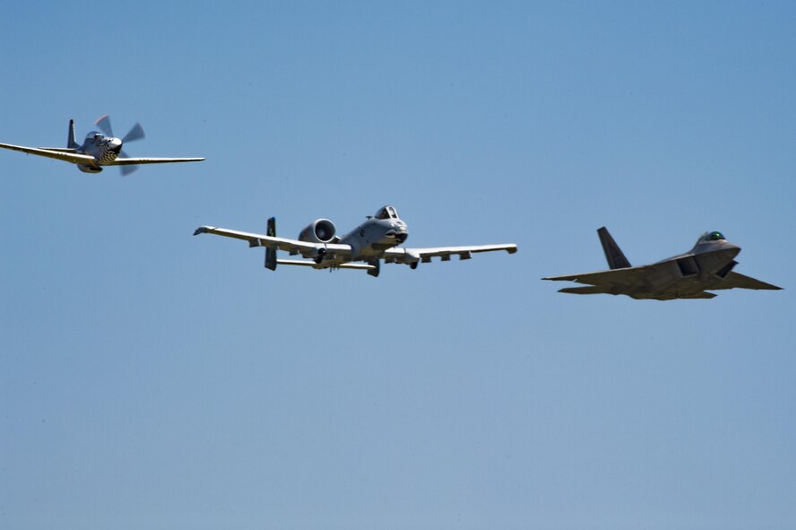 A P-51 Mustang, A-10C Thunderbolt II and F-22 Raptor fly in the heritage formation during the Wings Over Wayne Airshow 2017, May 19, 2017, at Seymour Johnson Air Force Base, N.C. The heritage flight is performed by multiple aircraft at events throughout the United States. Originally established in 1997, the heritage flight showcases the past, present and future generations of aircraft to bolster recruiting. (U.S. Air Force photo by Staff Sgt. Eric Summers Jr.)