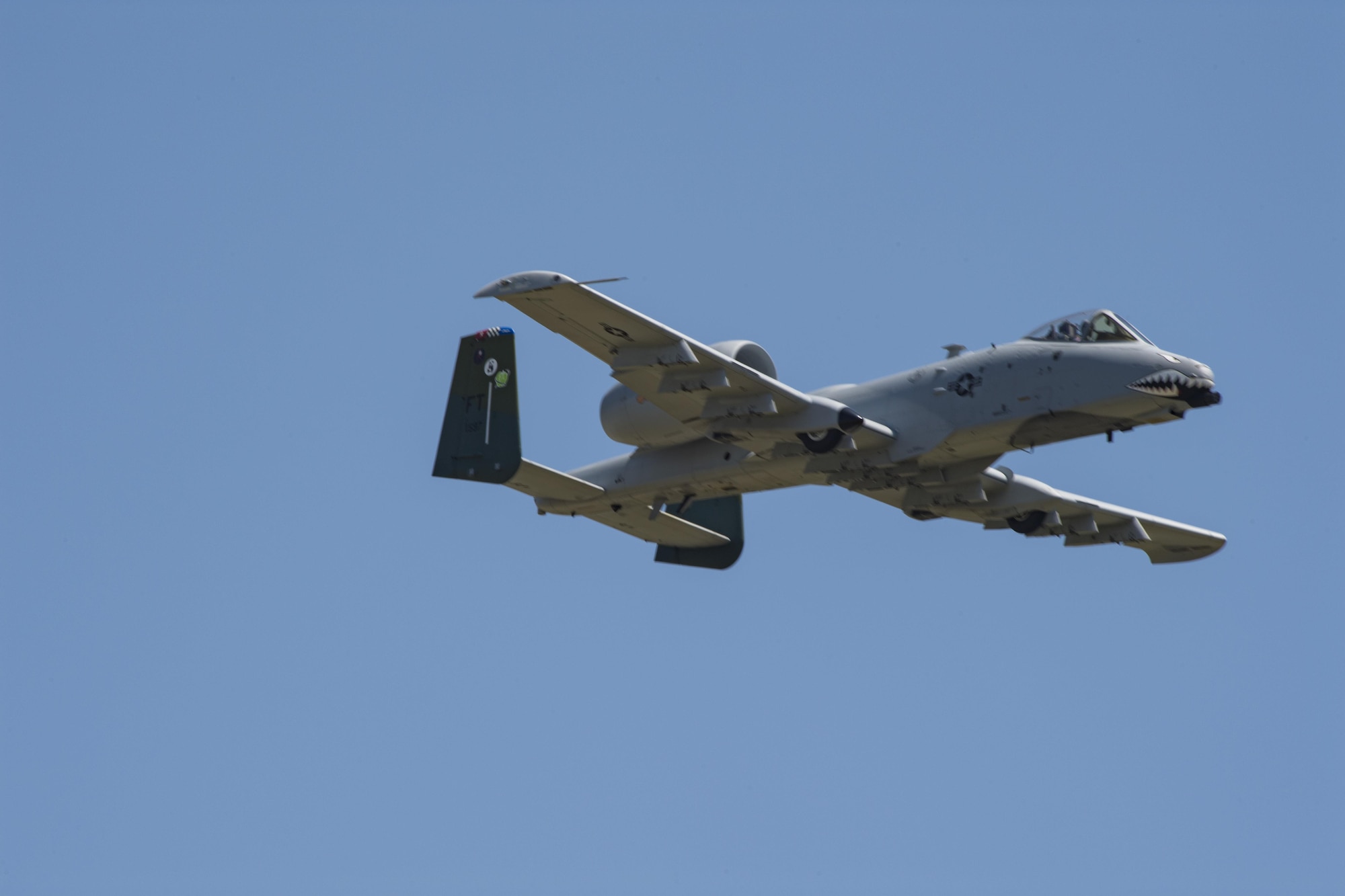 An A-10C Thunderbolt II cruises by the crowd after performing the heritage flight, May 19, 2017, at Seymour Johnson Air Force Base, N.C. The heritage flight is performed by multiple aircraft at events throughout the United States. Originally established in 1997, the heritage flight showcases the past, present and future generations of aircraft to bolster recruiting. (U.S. Air Force photo by Staff Sgt. Eric Summers Jr.)