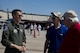 Capt. Joseph Morrin, A-10 East Heritage Team pilot, interacts with attendees during the Wings Over Wayne Airshow 2017, May 20, 2017, at Seymour Johnson Air Force Base, N.C. The heritage flight is performed by multiple aircraft at events throughout the United States. Originally established in 1997, the heritage flight showcases the past, present and future generations of aircraft to bolster recruiting. (U.S. Air Force photo by Staff Sgt. Eric Summers Jr.)