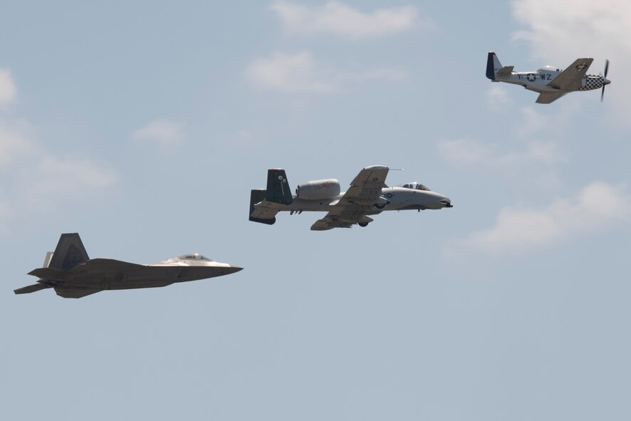 A P-51 Mustang, A-10C Thunderbolt II and F-22 Raptor fly in the heritage formation during the Wings Over Wayne Airshow 2017, May 19, 2017, at Seymour Johnson Air Force Base, N.C. The heritage flight is performed by multiple aircraft at events throughout the United States. Originally established in 1997, the heritage flight showcases the past, present and future generations of aircraft to bolster recruiting. (U.S. Air Force photo by Staff Sgt. Eric Summers Jr.)