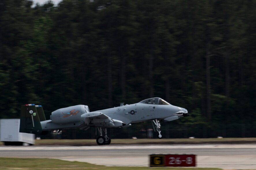 An A-10C Thunderbolt II lands after performing a heritage flight during the Wings Over Wayne Airshow 2017, May, 21, 2017, at Seymour Johnson, N.C. The heritage flight is performed by multiple aircraft at events throughout the United States. Originally established in 1997, the heritage flight showcases the past, present and future generations of aircraft to bolster recruiting. (U.S. Air Force photo by Staff Sgt. Eric Summers Jr.)