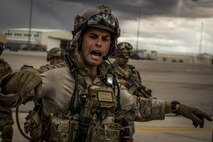 A U.S. Air Force combat rescue officer directs U.S. military and coalition forces during Angel Thunder 17 at Davis-Monthan, Ariz., May 9, 2017. Angel Thunder is a two-week, Air Combat Command-sponsored, joint certified and accredited personnel recovery exercise focused on search and rescue. The exercise is designed to provide training for personnel recovery assets using a variety of scenarios to simulate deployment conditions and contingencies. Photo altered due to security concerns. (U.S. Air Force photo by Staff Sgt. Corey Hook)