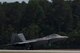 A F-22 Raptor lands after performing a heritage flight during the Wings Over Wayne Airshow 2017, May, 21, 2017, at Seymour Johnson, N.C. The heritage flight is performed by multiple aircraft at events throughout the United States. Originally established in 1997, the heritage flight showcases the past, present and future generations of aircraft to bolster recruiting. (U.S. Air Force photo by Staff Sgt. Eric Summers Jr.)