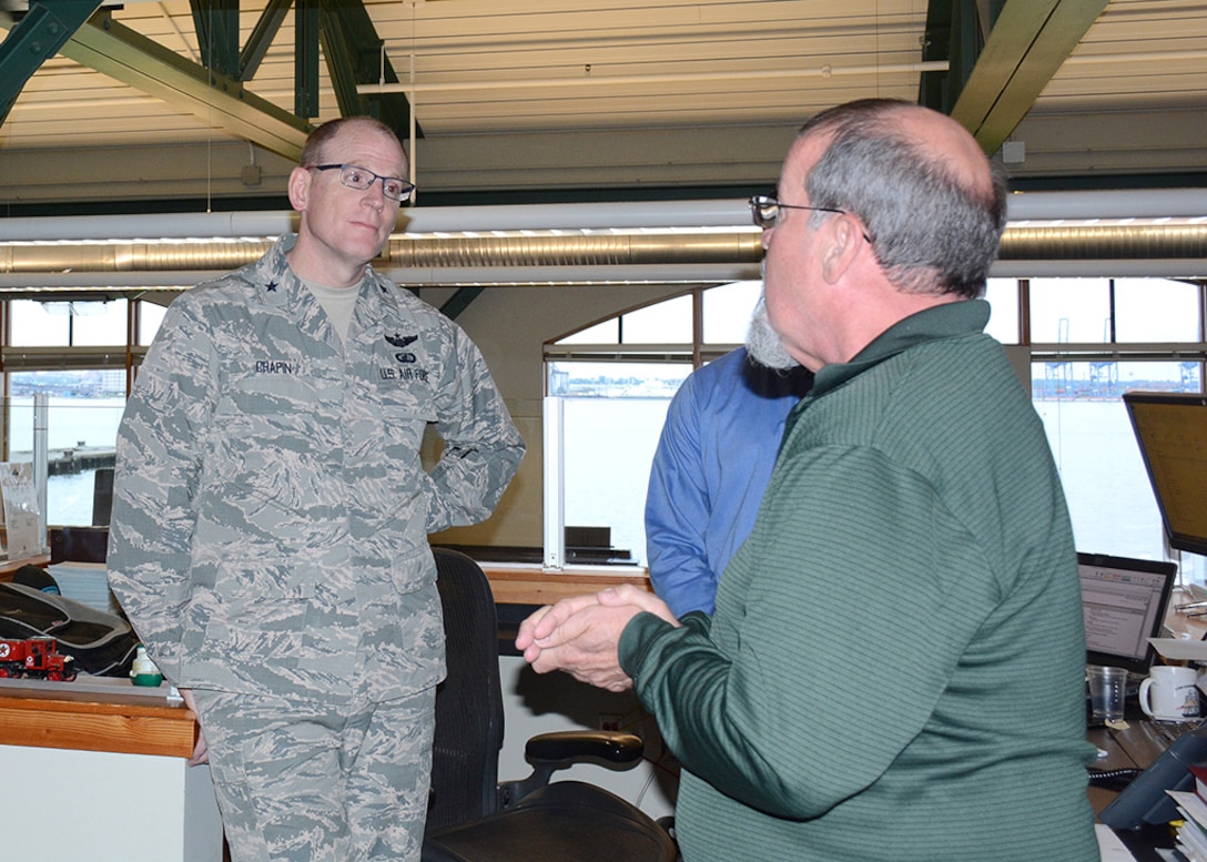 Vane Brothers General Manager Don Browning explains the operations team tracking system that monitors the progress of barges and tugs throughout the Eastern Seaboard to DLA Energy Commander Air Force Brig. Gen. Martin Chapin and DLA Energy Americas East Commander Army Lt. Col. Christian Meisel at Defense Fuel Support Point Baltimore May 22.