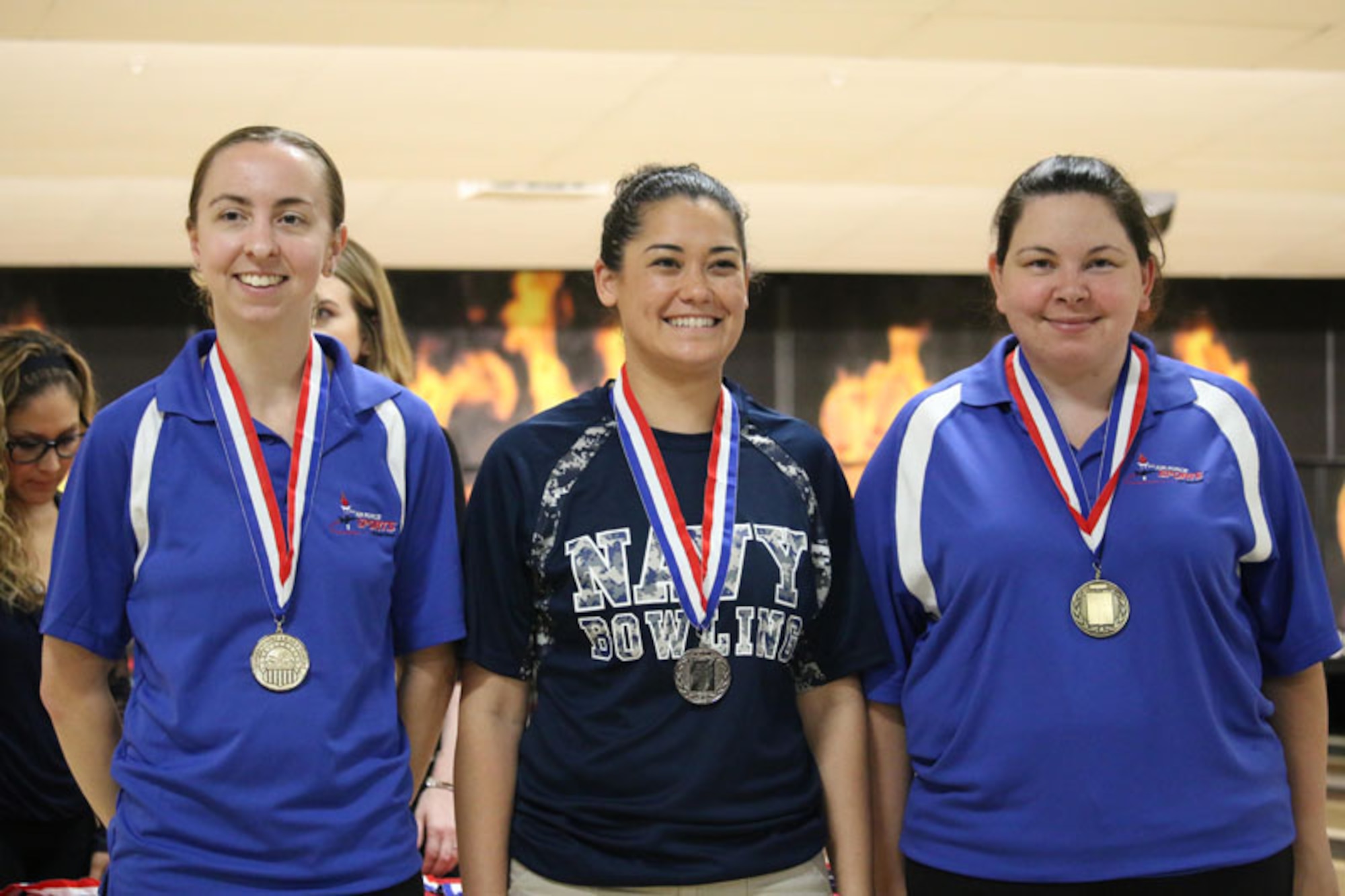 From left to right: Gold medalist Air Force Capt. Danielle Crowder of Little Rock AFB,Arkansas; Silver medalist Navy Petty Officer 1st Class Melanie Griffith of the USS Essex; and Air Force Staff Sgt. Natasha Sanchez of Travis AFB, California on the podium at the 2017 Armed Forces Bowling Championship hosted at Marine Corps Base Camp Pendleton, California from 5-8 May at the Leatherneck Lanes.