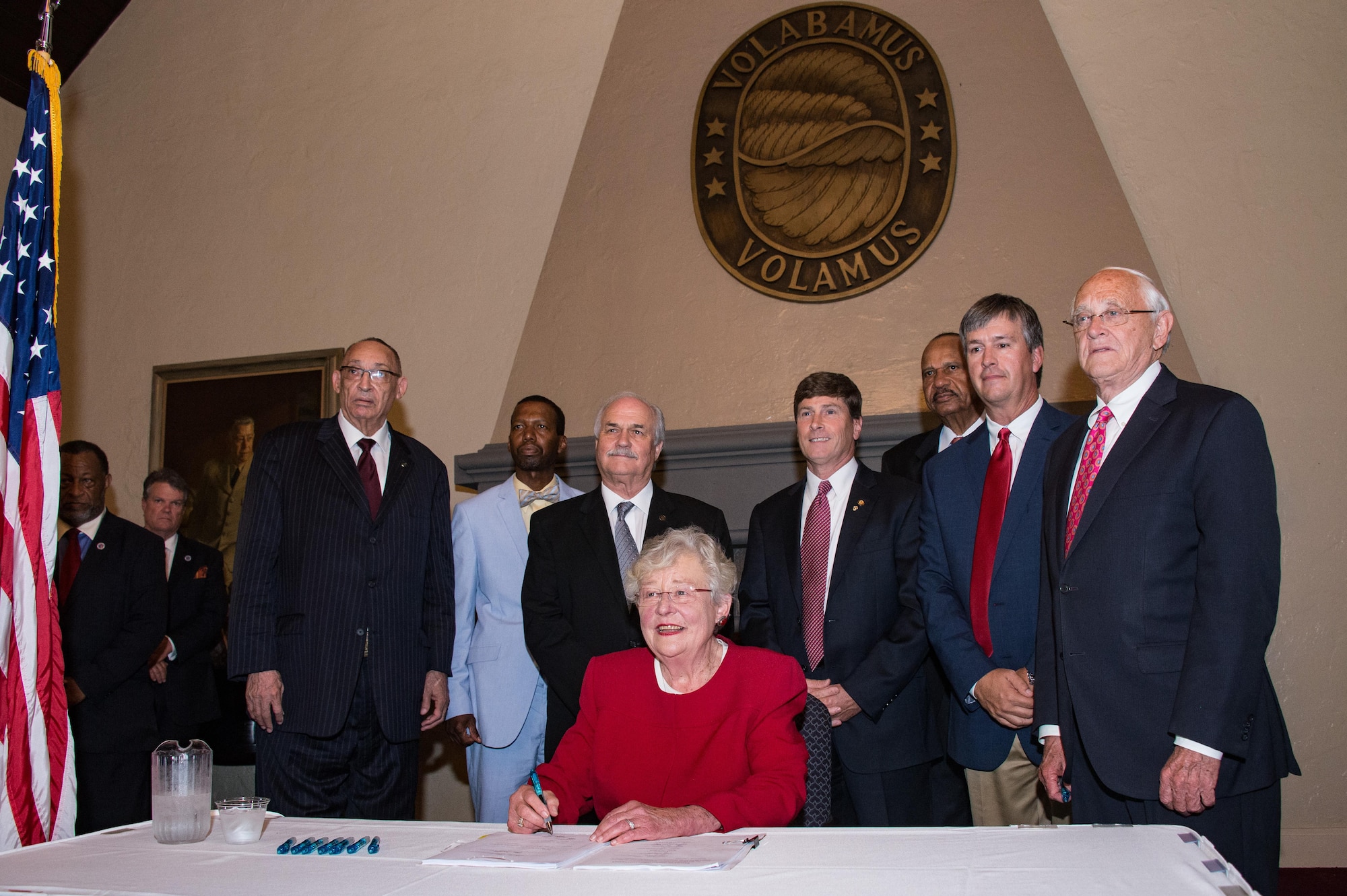 Alabama Governor Kay Ivey signs legislation benefiting Alabama's military members at a special ceremony, May 23, 2017, Maxwell Air Force Base, Ala. The bills covered a variety of subjects including Guardsmen employment rights, recruiter access to state educational institutions, Guard bill for college scholarships for dependents of disabled veterans, and expansion of military industrial access funds to installation roads, bridges, and power lines (US Air Force photo by Melanie Rodgers Cox/Released)