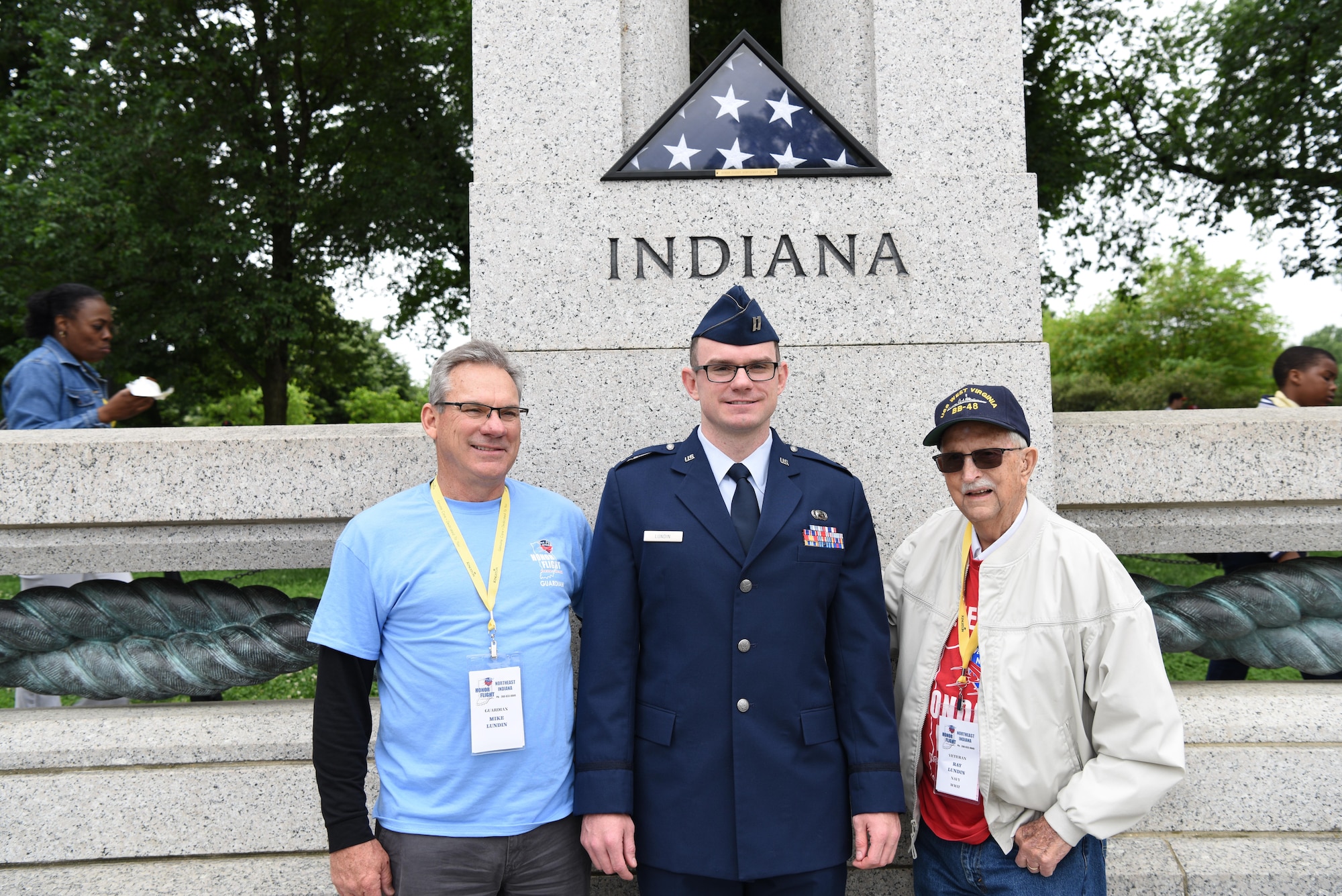 First Lt. Nicholas Lundin, 480th Intelligence, Reconnaissance and Surveillance Wing chief of current operations, stands between his dad Michael Lundin and grandfather Ray Lundin after his promotion ceremony May 24, 2017 at the World War II memorial in Washington D.C. Lundin’s grandfather served in the Pacific for the U.S. Navy during World War II and was selected to travel to the nation’s Capital through an Honor Flight program in Northeast Indiana. The program affords WWII veterans the opportunity to fly for free to visit and reflect at their respective memorial. (U.S. Air Force photo by Tech. Sgt. Darnell T. Cannady)