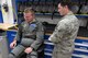 Senior Airman Carlos Garza, 80th Operations Support Squadron aircrew flight equipment technician, pushes compressed air into the G-suit of a student pilot to test the fit. Garza hand fits each suit to the individual pilot to ensure proper fit and function. (U.S. Air Force photo by Senior Airman Robert L. McIlrath)