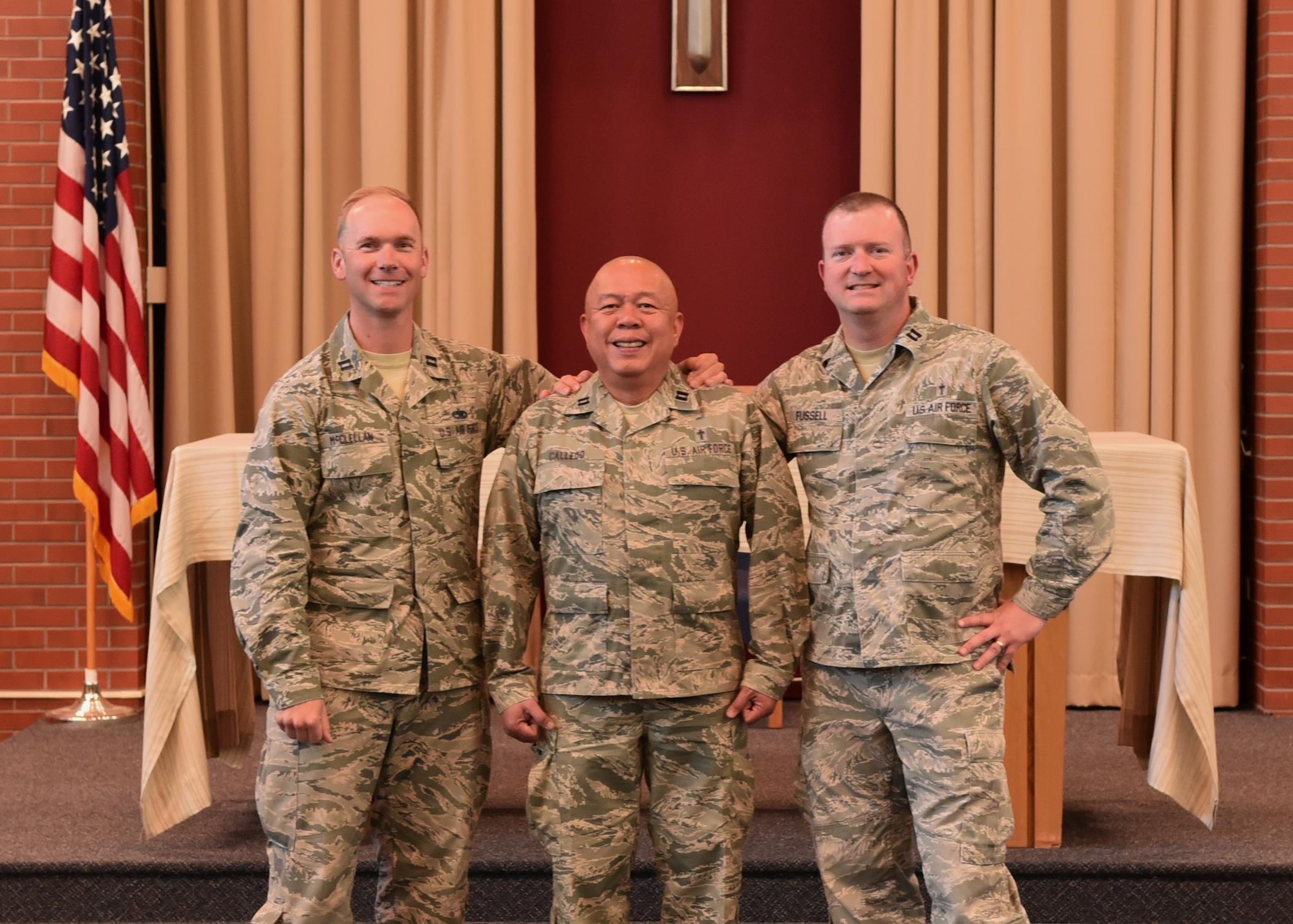 90th Missile Wing Chaplains (from left to right) Samuel McClellan, James Calledo, Thomas Fussell. Stand join together at the High Plains Chapel at F.E. Warren Air Force Base, Wyo., May 23, 2017. The chaplains served the Mighty Ninety for 3 years together and are now leaving for new assignments.  (U.S. Air Force photo by Terry Higgins)