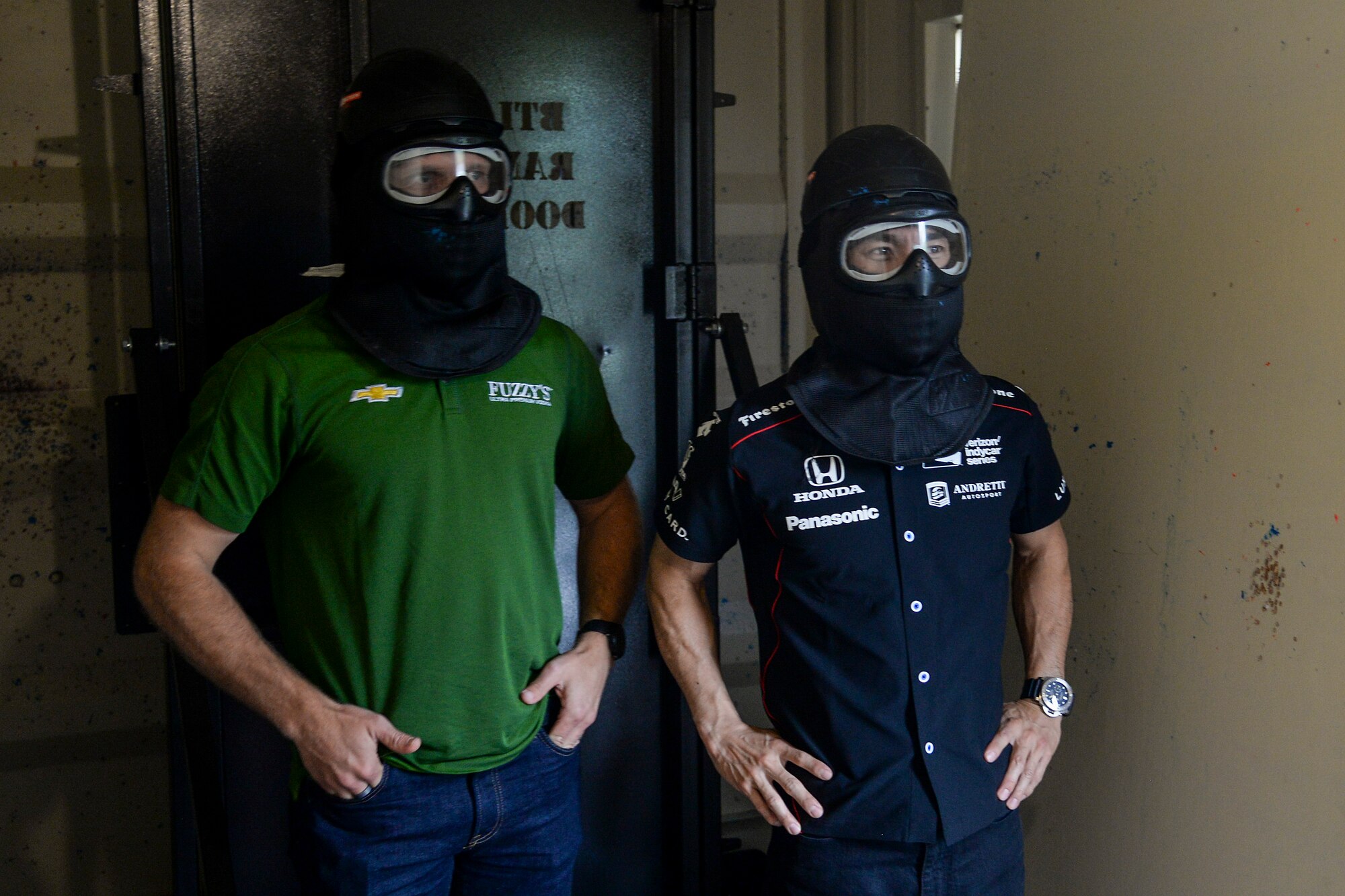 Ed Carpenter and Takuma Sato, Indy Car Series drivers, wait for a shooting excercise to begin during their visit May 23, 2017 at Scott Air Force base Illinois. The drivers met with Airmen from several suadrons to learn about what Scott AFB brings to the fight.(U.S. Air Force photo by Airman Chad Gorecki)