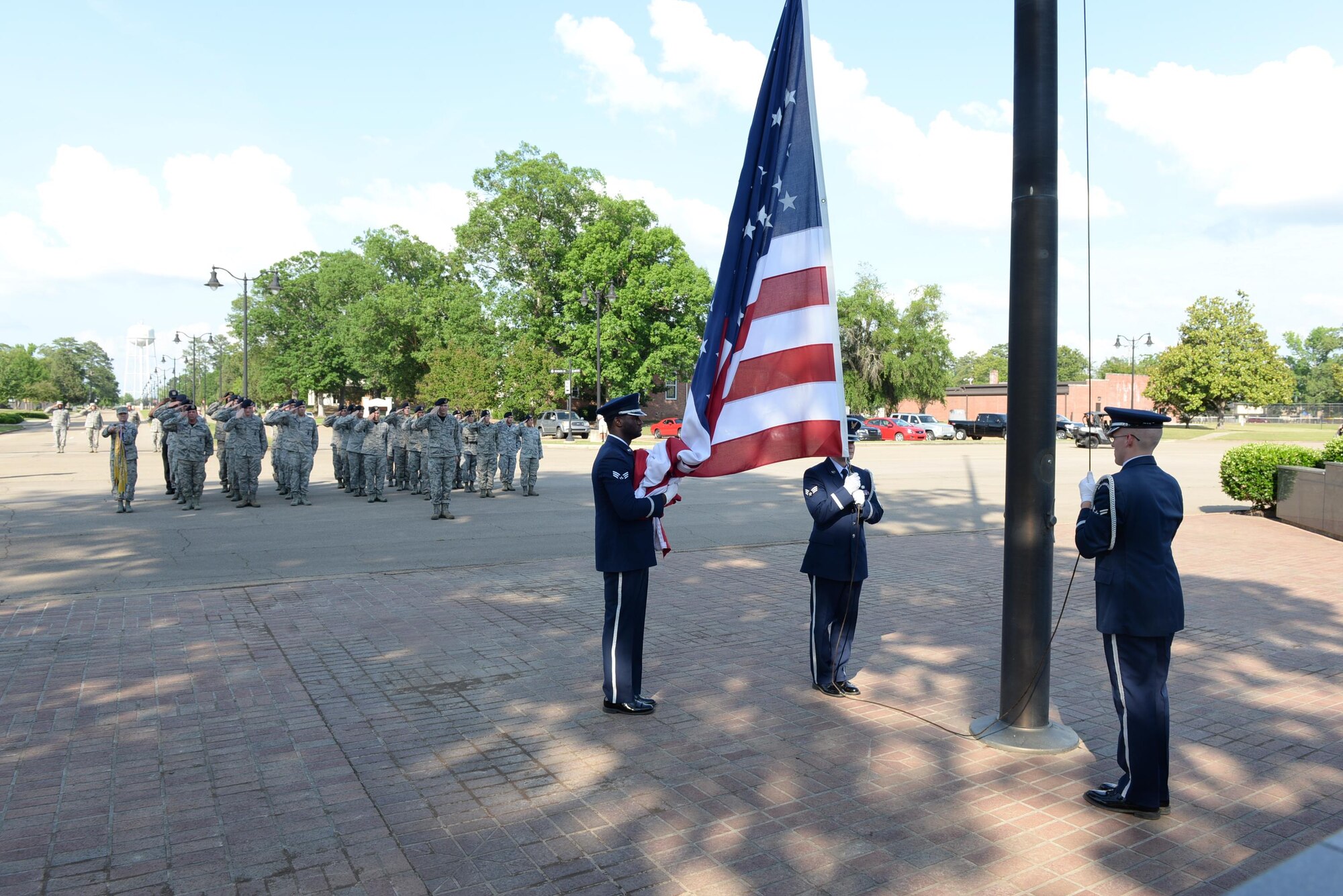 The 14th Security Forces Squadron salutes the flag during a retreat ceremony May 19, 2017, at the Gene Smith Plaza on Columbus Air Force Base, Mississippi. Police Week honors law enforcement officers across the nation.