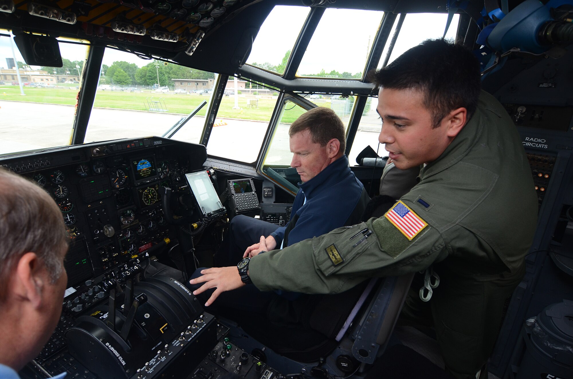 1st Lt. William Jones, 700th Airlift Squadron C-130 pilot, showcases a C-130 Hercules cockpit to members of the Honorary Commanders Association Class of 2017 during their annual "Dobbins Day" May 25, 2017 at Dobbins Air Reserve Base, Georgia. The HCA annually selects community and business leaders and pairs them with military commanders in a yearlong program, giving the leaders the opportunity to learn more about local military activities, their impact on our economy and various aspects of the national defense system. (U.S. Air Force photo/Don Peek)