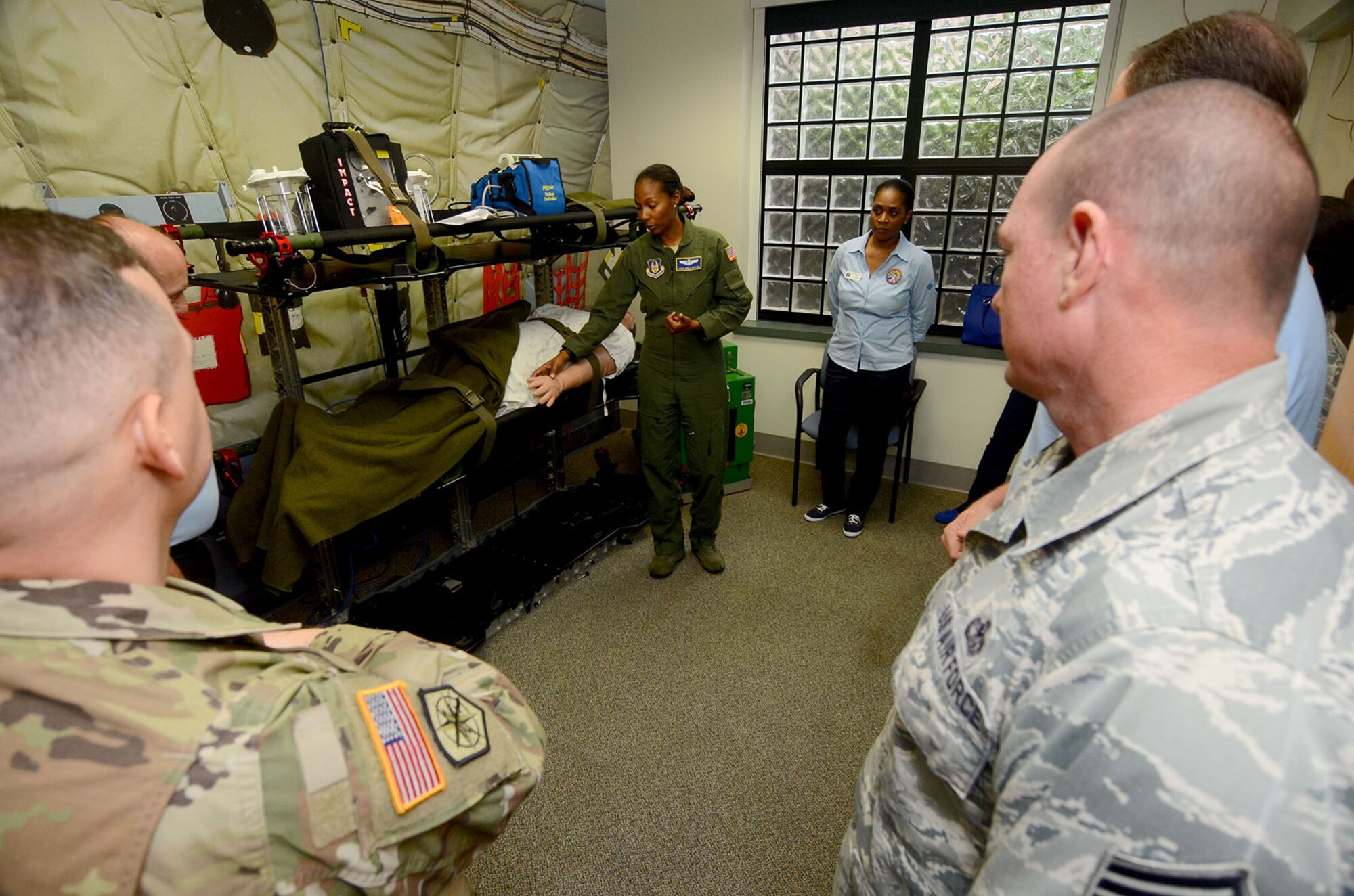 Master Sgt. Malia Butler, Aeromedical Evacuation Squadron training manager, gives members of the Honorary Commanders Association Class of 2017 a tour of the aeromedical evacuation training facility during their annual "Dobbins Day" May 25, 2017 at Dobbins Air Reserve Base, Georgia. The HCA annually selects community and business leaders and pairs them with military commanders in a yearlong program, giving the leaders the opportunity to learn more about local military activities, their impact on our economy and various aspects of the national defense system. (U.S. Air Force photo/Don Peek)