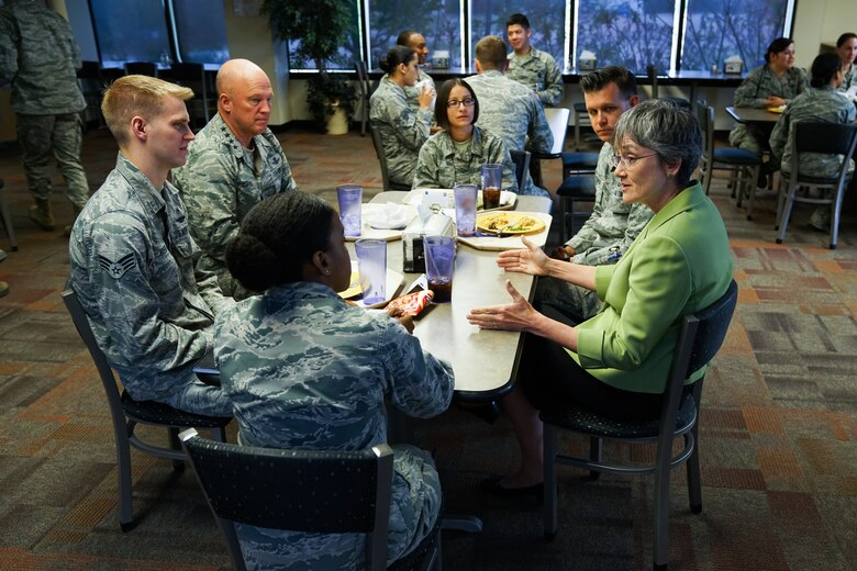 Secretary of the Air Force Heather Wilson (right), speaks with Gen. John Raymond, Air Force Space Command commander (left) and other Schriever Airmen at Schriever Air Force Base, Colorado, Tuesday, May 23, 2017. Wilson made time to speak with several groups of different Airmen within the AFSPC during her visit. (U.S. Air Force photo/Chris DeWitt)