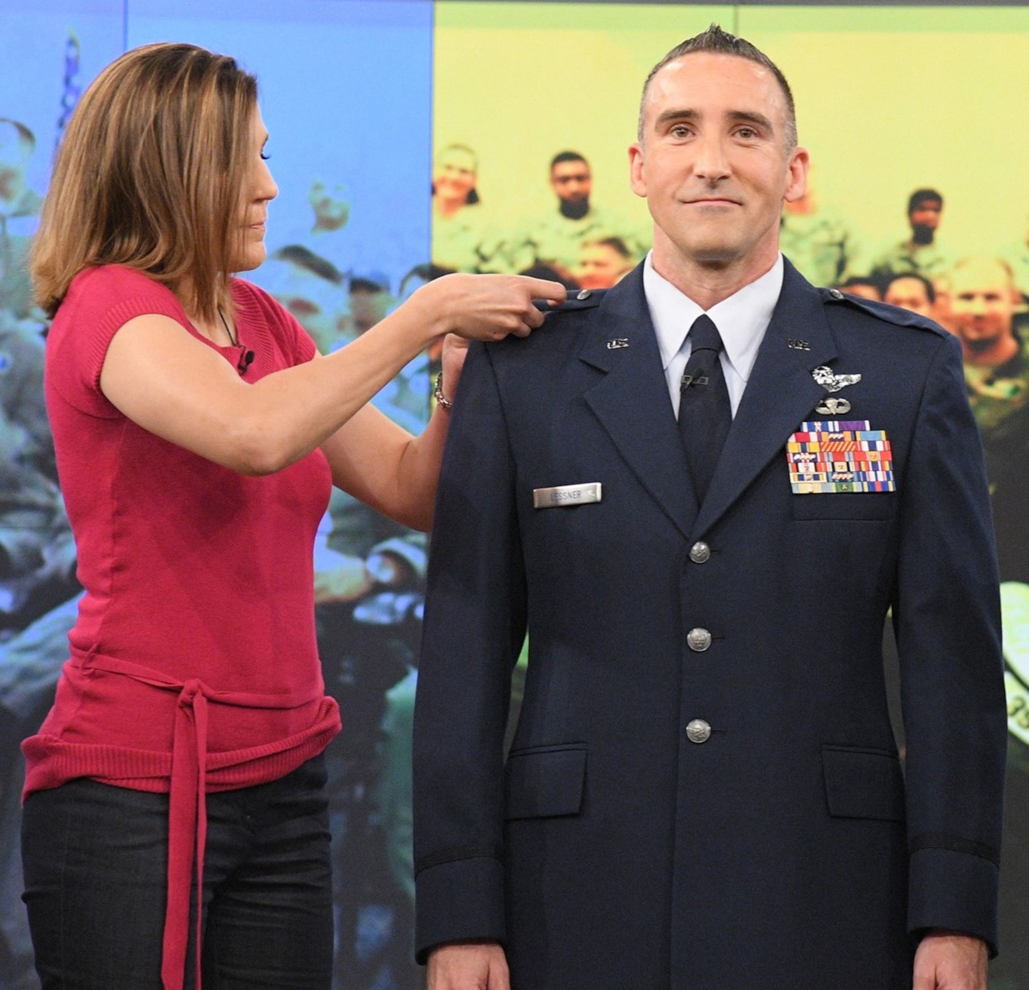 Lt. Col. Thomas Lessner’s wife Kathleen pins on his new rank insignia following his on-air promotion on “The View”. Lessner appeared on the show in support of a larger Memorial Day tribute featuring former U.S, Secretary of Defense, Donald Rumsfeld as the guest host. Lessner shared his story of resilience that helped him and his family overcome many challenges, including a rocket propelled grenade strike on his helicopter during Operation Iraqi Freedom. (ABC courtesy photo).
