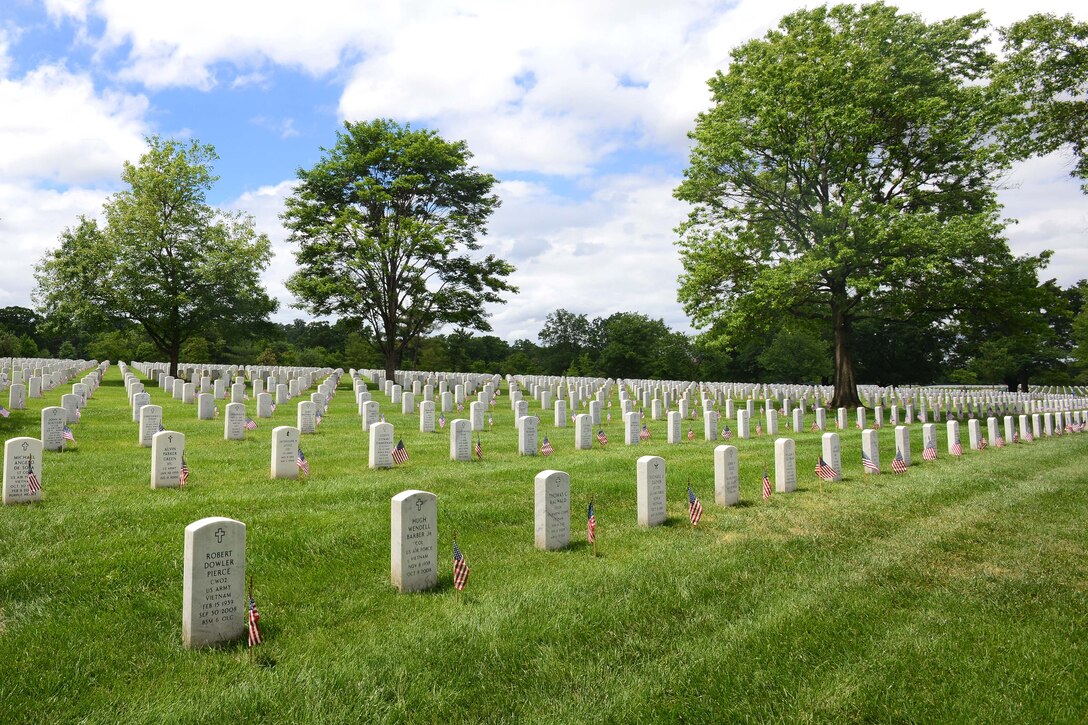 American flags placed by soldiers participating in "Flags In" adorn the headstones at Arlington National Cemetery in Arlington, Va., May 25, 2017. DoD photo by Sebastian J. Sciotti Jr.