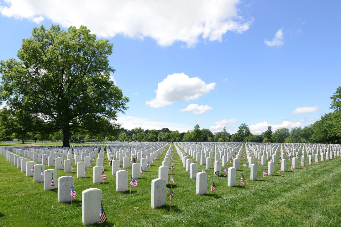 American flags placed by soldiers participating in "Flags In" adorn the headstones at Arlington National Cemetery in Arlington, Va., May 25, 2017. DoD photo by Sebastian J. Sciotti Jr.