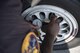 U.S. Air Force Staff Sgt. Byron Cole, Pacific Air Forces F-16 Demonstration Team dedicated crew chief, checks the tire pressure of the F-16 Fighting Falcon during a pre-flight inspection at Marine Corps Air Station Iwakuni, Japan, May 22, 2017. The tire pressure is one of several parts checked prior to take-off, ensuring the safety of the pilot. (U.S. Air Force photo by Staff Sgt. Melanie Hutto)