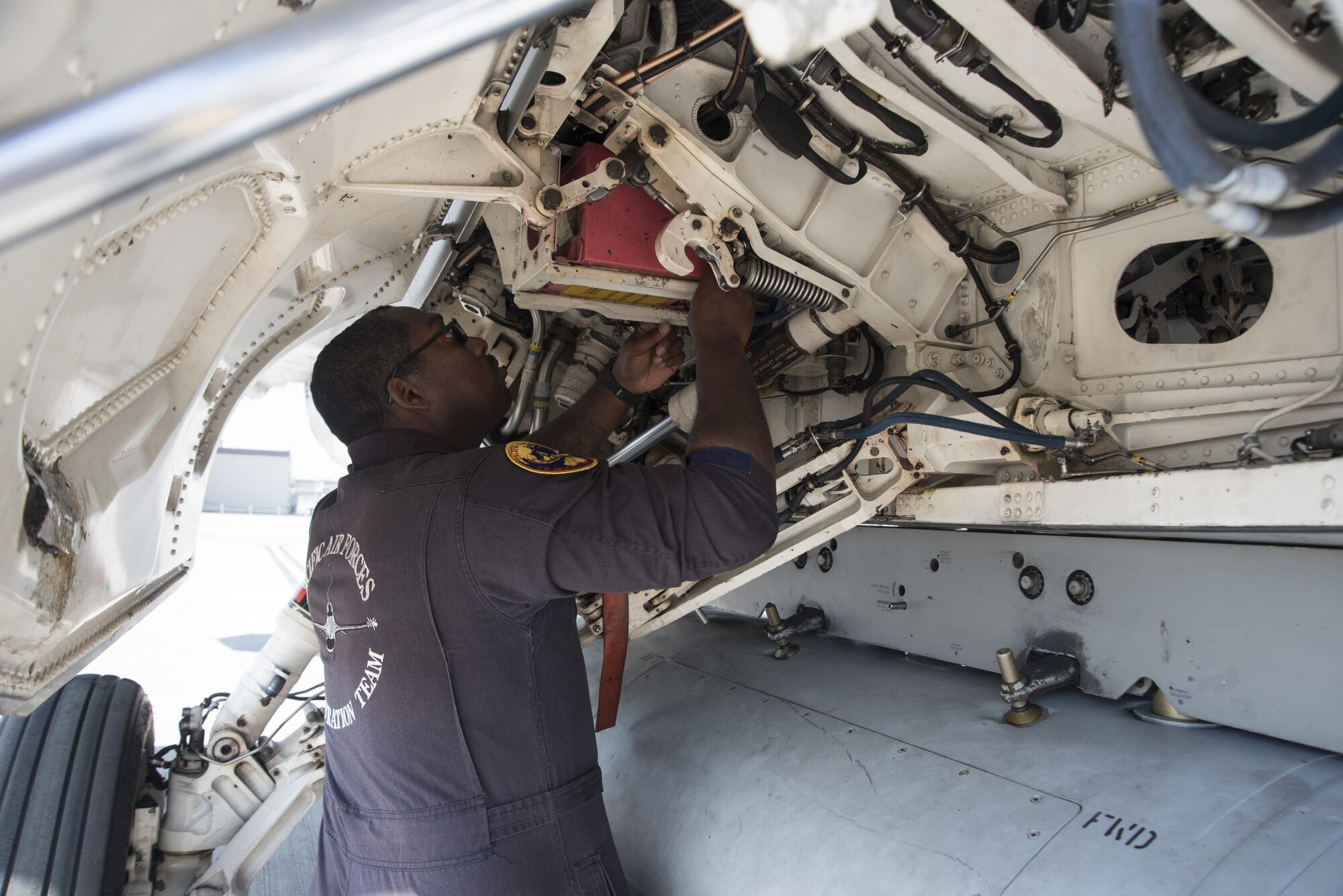 U.S. Air Force Staff Sgt. Byron Cole, Pacific Air Forces F-16 Demonstration Team dedicated crew chief, examines the F-16 Fighting Falcon during a pre-flight inspection at Marine Corps Air Station Iwakuni, Japan, May 22, 2017. Although their show schedule kept the team busy, this was not their primary job. They must maintain readiness to deploy and support the 35th Fighter Wing whenever is needed. (U.S. Air Force photo by Staff Sgt. Melanie Hutto)