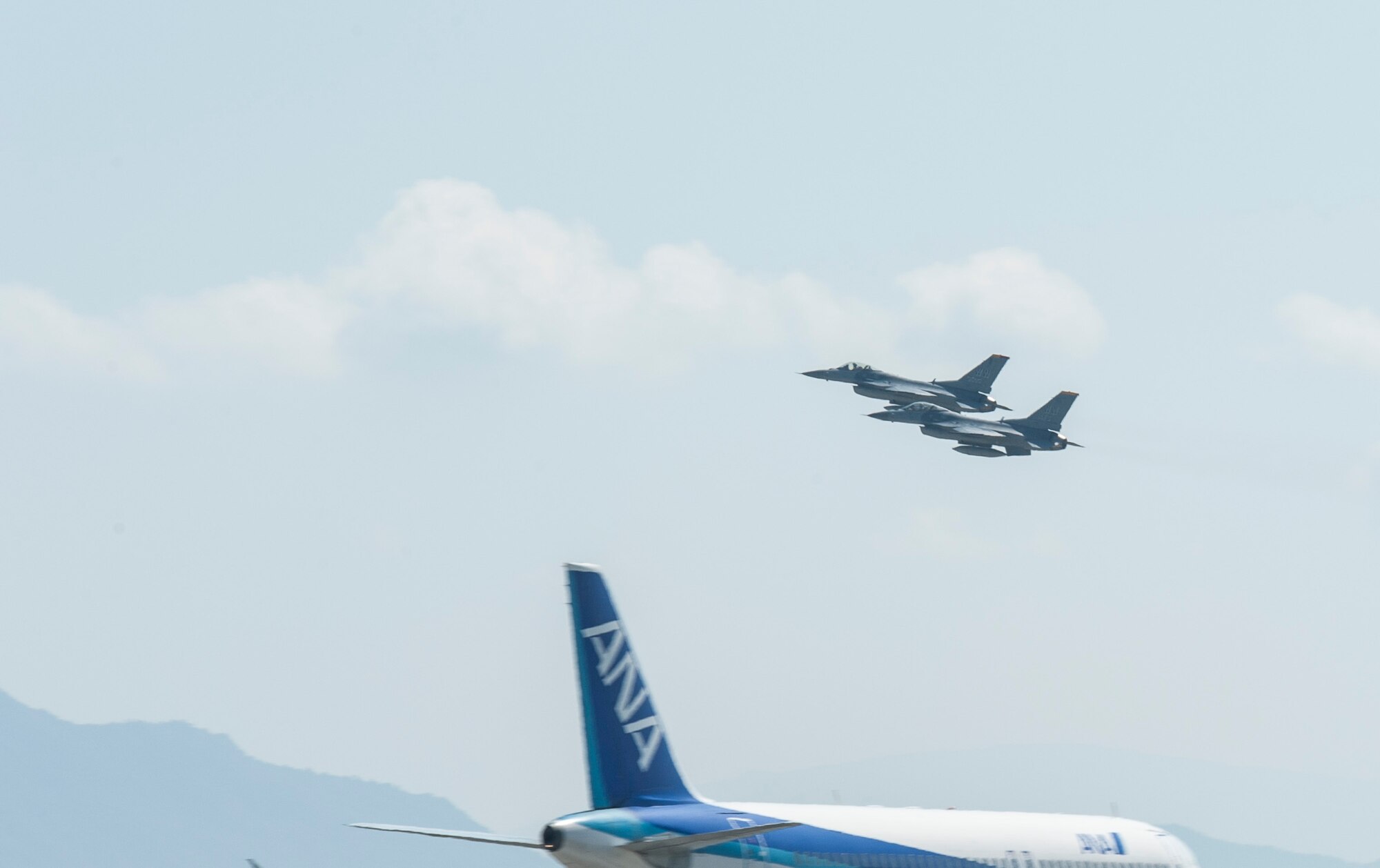 U.S. Air Force Maj. Richard Smeeding, the Pacific Air Forces F-16 Demonstration Team pilot, and Capt. Dakota Newton, the PACAF Demonstration Team safety observer, take-off together from Marine Corps Air Station Iwakuni, Japan, May 22, 2017. The team spent the weekend performing at the Hofu Air Festival. The pilots returned to Kunsan Air Base, Republic of Korea, while the runway at Misawa AB is under construction. (U.S. Air Force photo by Staff Sgt. Melanie Hutto)