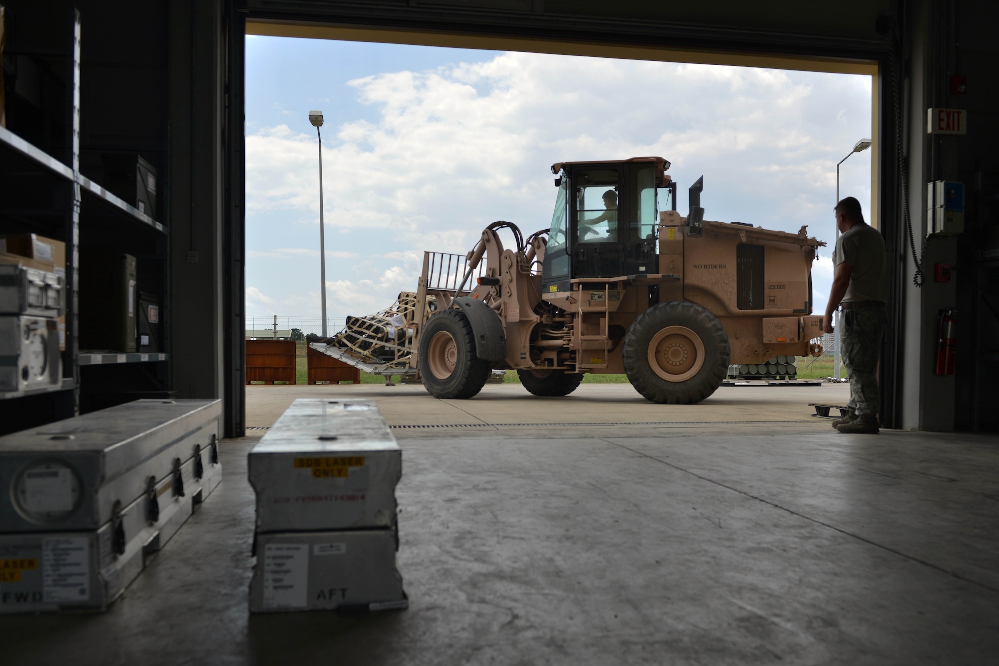 A U.S. Airman assigned to the 447th Expeditionary Aircraft Maintenance Squadron (EAMXS) transports munitions for assembly May 24, 2017, at Incirlik Air Base, Turkey. The 447th EAMXS supports Operation Inherent Resolve by maintaining aircraft and supplying them with munitions. (U.S. Air Force photo by Senior Airman John Nieves Camacho)