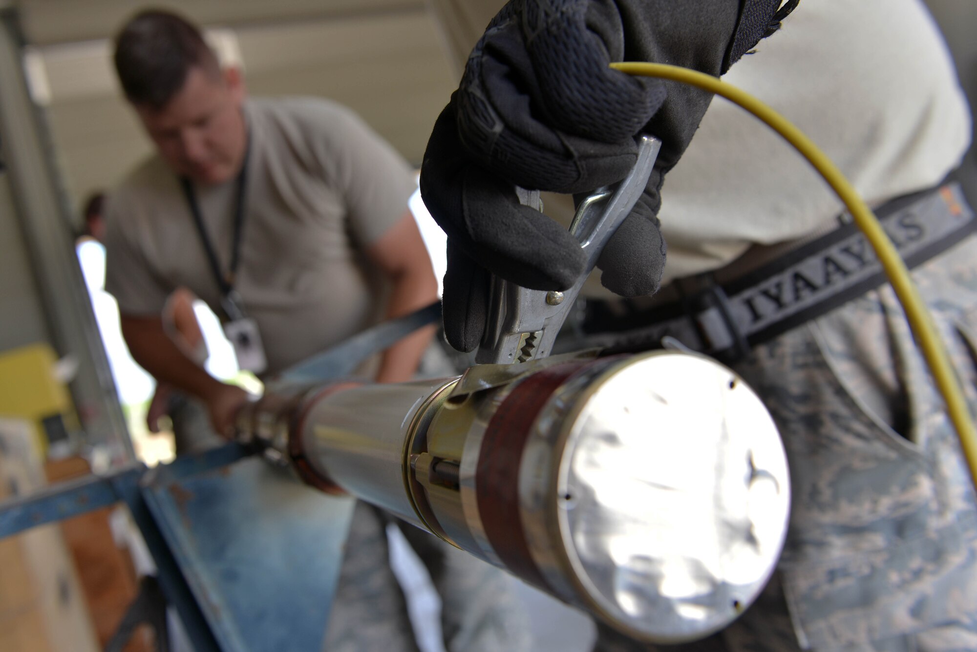 U.S. Air Force Tech. Sgt. Michael Postel (left), 447th Expeditionary Aircraft Maintenance Squadron (EAMXS) production superintendent, and Tech. Sgt. Jeremiah Webb, 447th EAMXS maintenance supervisor, assemble an Advanced Precision Kill Weapon System (APKWS) rocket, May 24, 2017, at Incirlik Air Base, Turkey. The APKWS rocket is designed to give warfighters low-cost surgical strike capability. (U.S. Air Force photo by Senior Airman John Nieves Camacho)