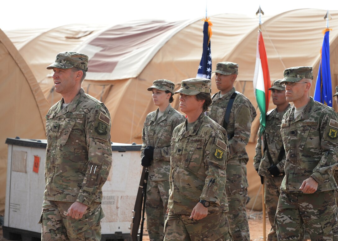 From left to right, Col. John Meiter, 409th Air Expeditionary Group commander, Lt. Col. Marlyce Roth, exiting 724th Expeditionary Air Base Squadron commander, and Lt. Col. Chance Geray, incoming 724th EABS commander, make an entrance to the 724th EABS change of command ceremony at Nigerien Air Base 201, Niger, May 15, 2017. During the ceremony Airmen in attendance rendered their final salute to Roth and their first salute to Geray. (U.S. Air Force photo by Senior Airman Jimmie D. Pike)
