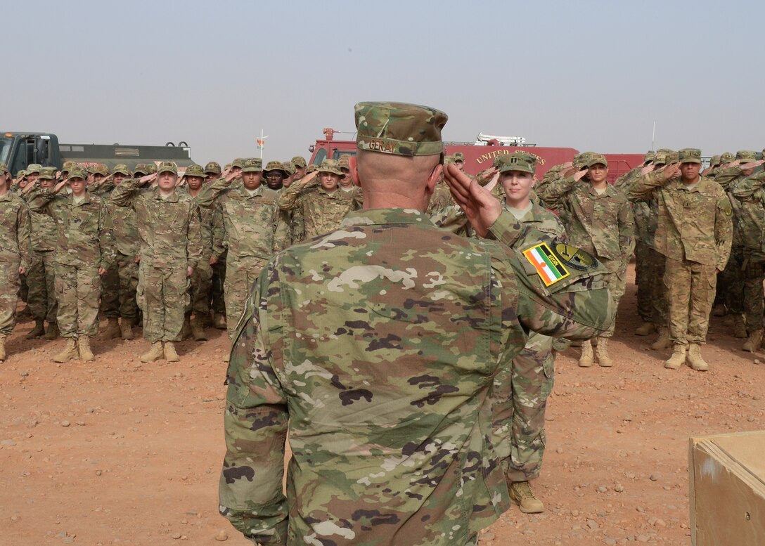 Lt. Col. Chance Geray, 724th Expeditionary Air Base Squadron commander, returns his new squadron’s first salute during a change of command ceremony at Nigerien Air Base 201, Niger, May 15, 2017. Upon taking command, Geray has aimed to continue building relations and developing teamwork with the Forces Armées Nigeriennes. (U.S. Air Force photo by Senior Airman Jimmie D. Pike)