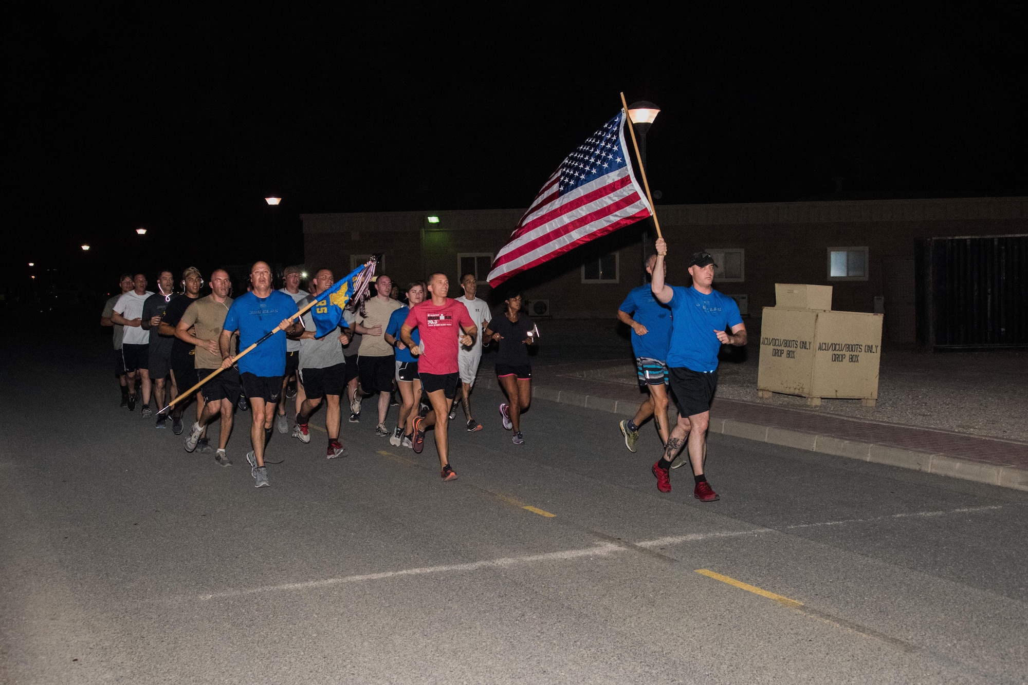 A group of air transportation specialists and other military members from the 386th Air Expeditionary Wing participated in a memorial run at an undisclosed location in Southwest Asia, May 19, 2017. The 386th Expeditionary Logistics Readiness Squadron aerial port flight hosted the 2017 Port Dawg Memorial Run in honor and memory of fallen air transportation specialists. (U.S. Air Force photo/Tech. Sgt. Jonathan Hehnly)