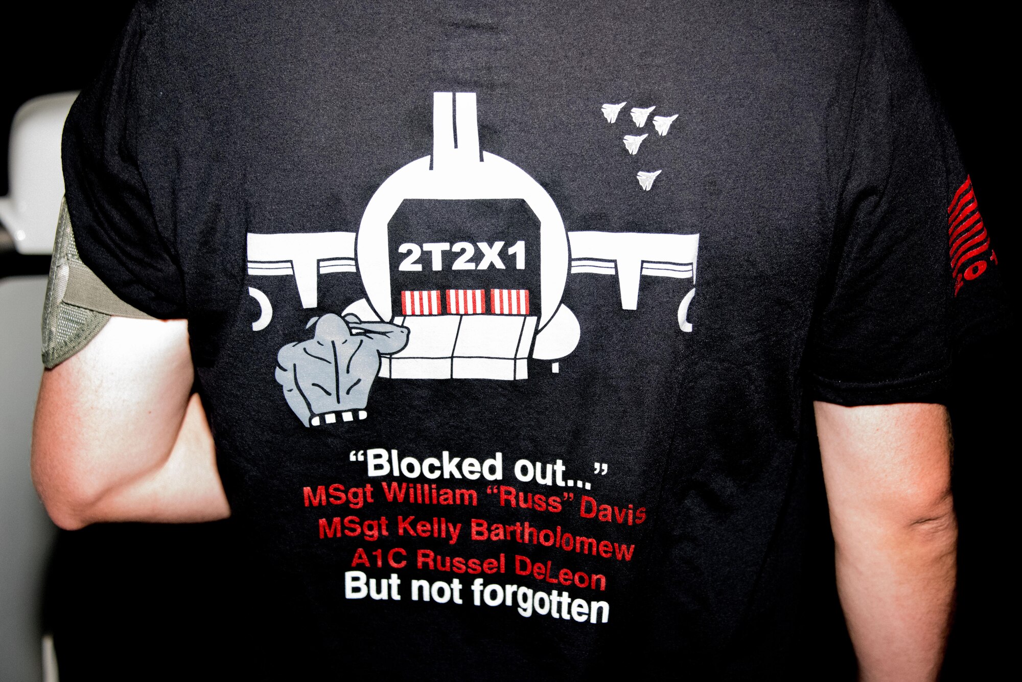A 386th Expeditionary Logistics Readiness Squadron aerial porter wears a shirt with the names of fallen air transportation specialists during the 2017 Port Dawg Memorial Run at an undisclosed location in Southwest Asia, May 19, 2017. The 386th Expeditionary Logistics Readiness Squadron aerial port flight hosted the 2017 Port Dawg Memorial Run in honor and memory of fallen air transportation specialists. (U.S. Air Force photo/Tech. Sgt. Jonathan Hehnly)