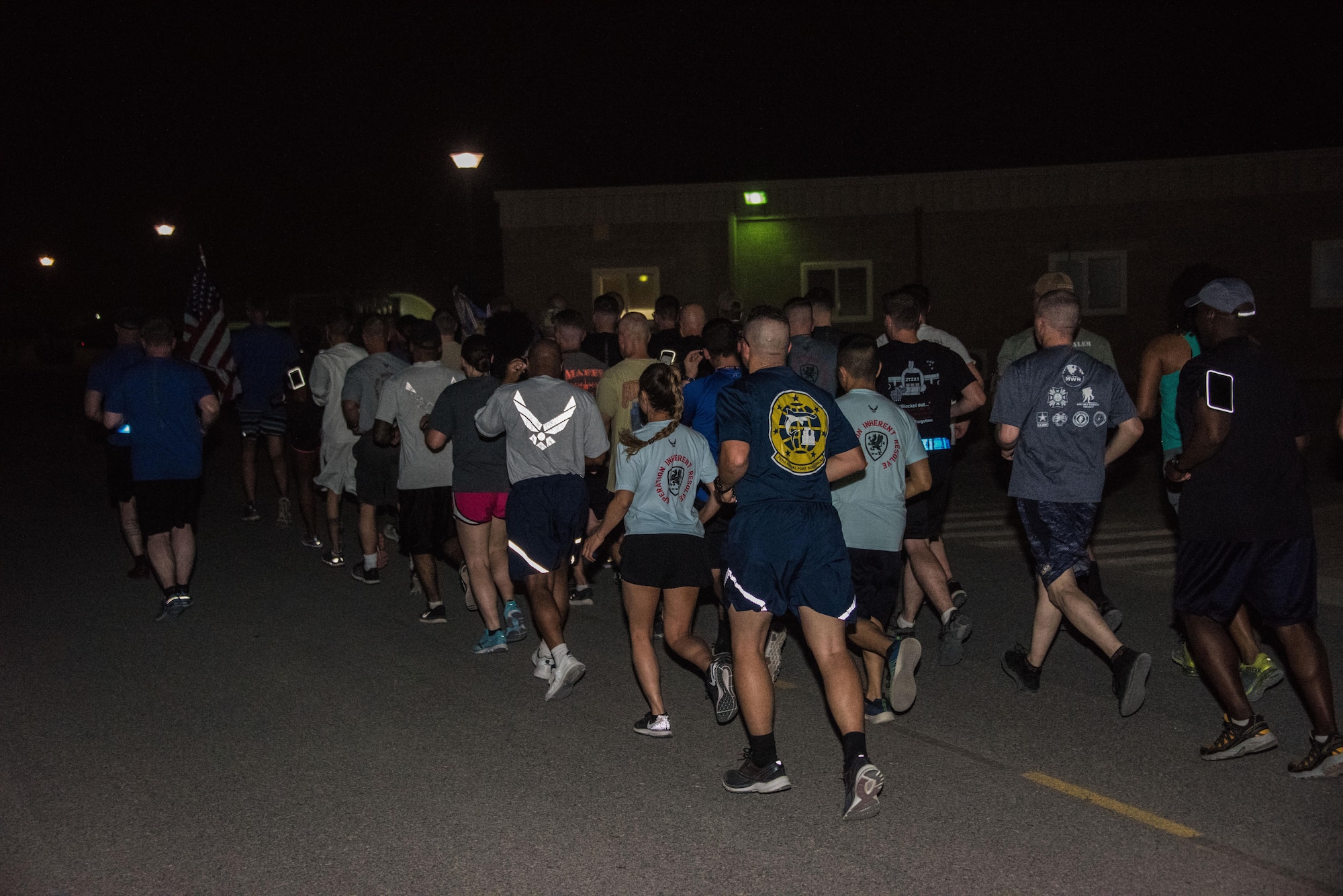 A group of air transportation specialists and other military members from the 386th Air Expeditionary Wing participated in a memorial run at an undisclosed location in Southwest Asia, May 19, 2017. The 386th Expeditionary Logistics Readiness Squadron aerial port flight hosted the 2017 Port Dawg Memorial Run in honor and memory of fallen air transportation specialists. (U.S. Air Force photo/Tech. Sgt. Jonathan Hehnly)