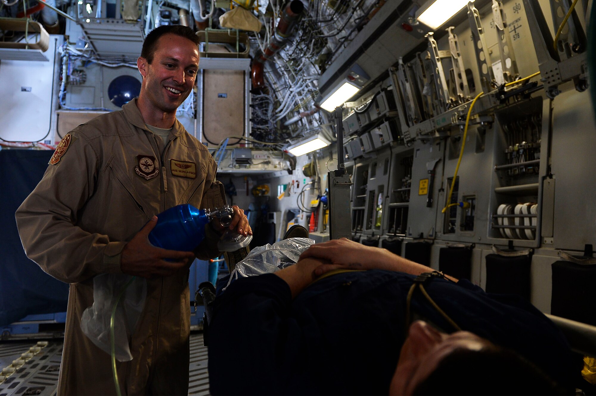 U.S. Air Force 1st Lt. Jake Silvola-Finch, 45th Aeromedical Evacuation Squadron interacts with a simulated patient during an exercise on Ramstein Air Base, Germany, May 24, 2017. The 721st Air Mobility Operations Group conducted a Rapid Global Mobility Exercise, which saw participation not just from Air Mobility Command Airmen assigned to Ramstein, but also the continental U.S. (U.S. Air Force photo by Airman 1st Class Joshua Magbanua) 