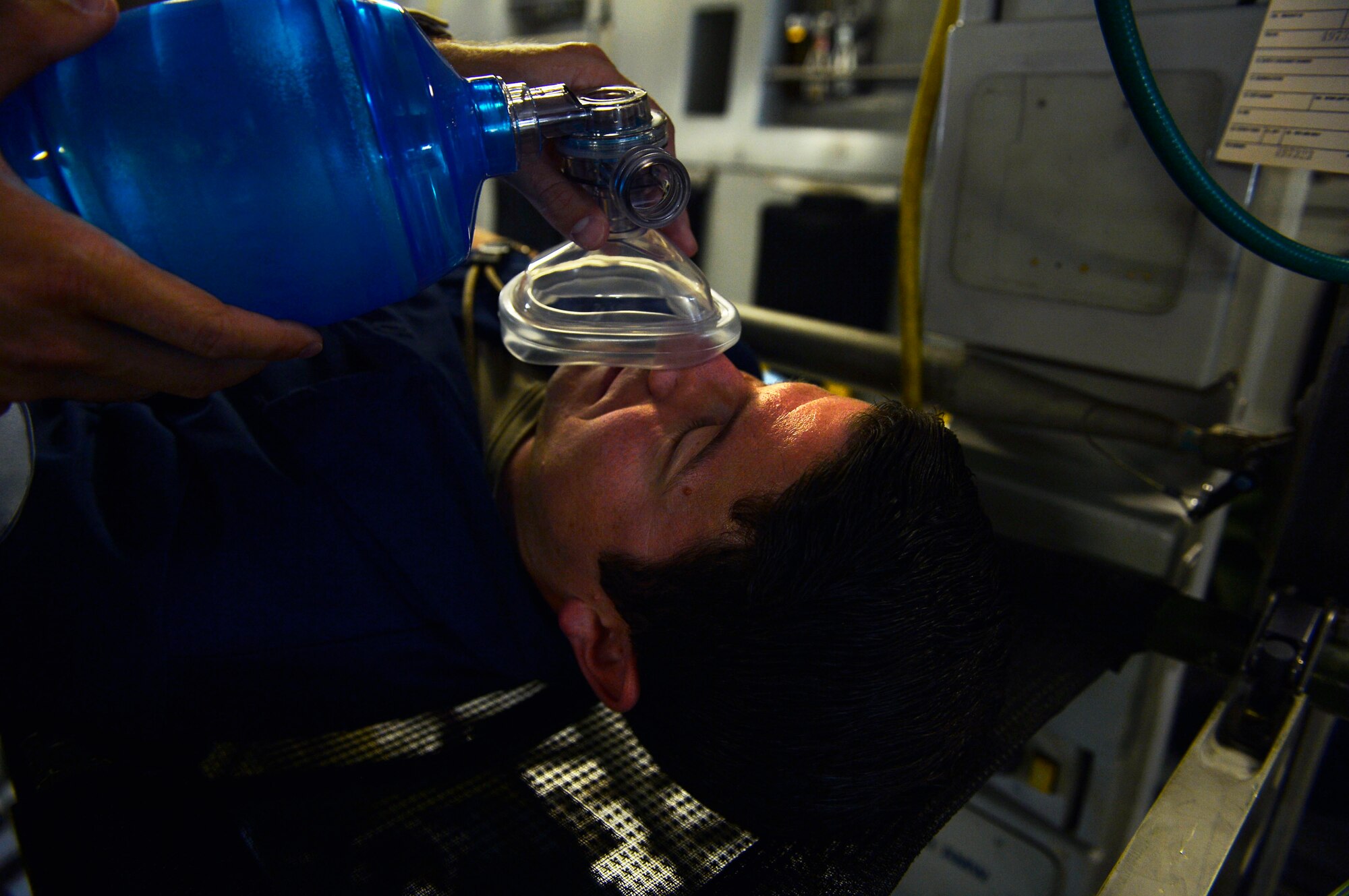 U.S. Air Force Tech. Sgt. John Lundberg, 721st Aircraft Maintenance Squadron crew chief, plays the role of a patient during an exercise on Ramstein Air Base, Germany, May 24, 2017. The 721st Air Mobility Operations Group included a variety of scenarios designed to test its Airmen’s response to adverse situations during a Rapid Global Mobility Exercise. (U.S. Air Force photo by Airman 1st Class Joshua Magbanua)
