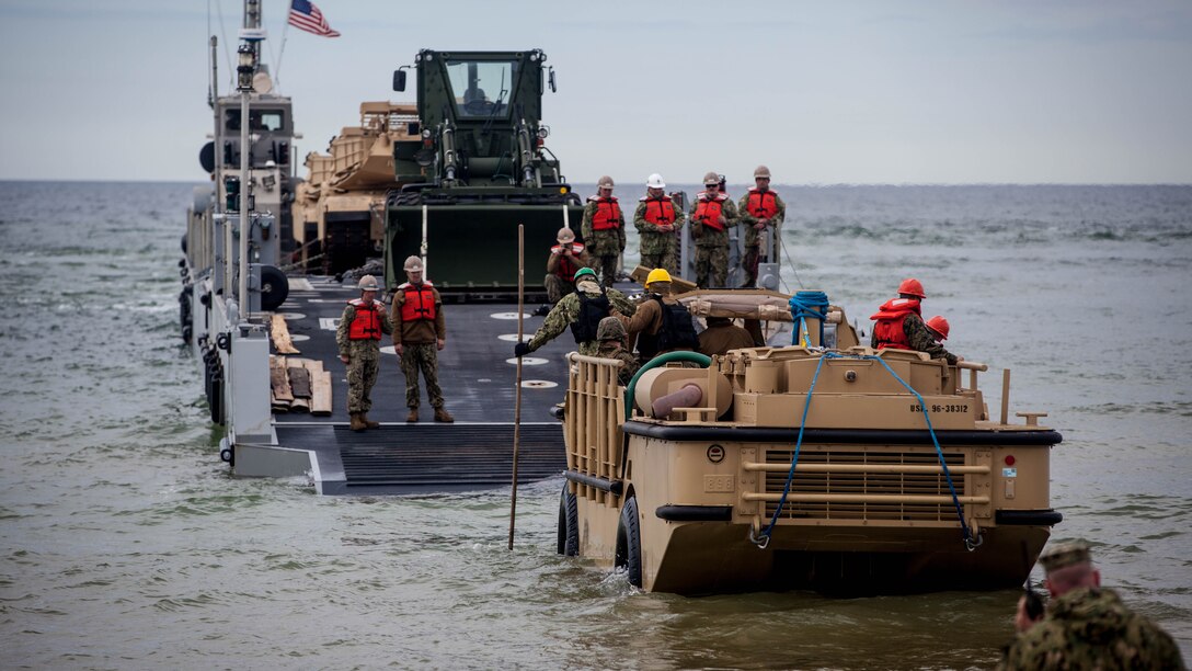 U.S. Sailors with Navy Cargo Handling Battalion One, conduct the off-loading of tanks during exercise Saber Strike 17 in Ventspils, Latvia, May 24, 2017. Exercise Saber Strike 17 is an annual combined-joint exercise conducted at various locations throughout the Baltic region and Poland. The combined training prepares allies and partners to respond more to regional crises and meet their own security needs by improving the security of borders and countering threats. 