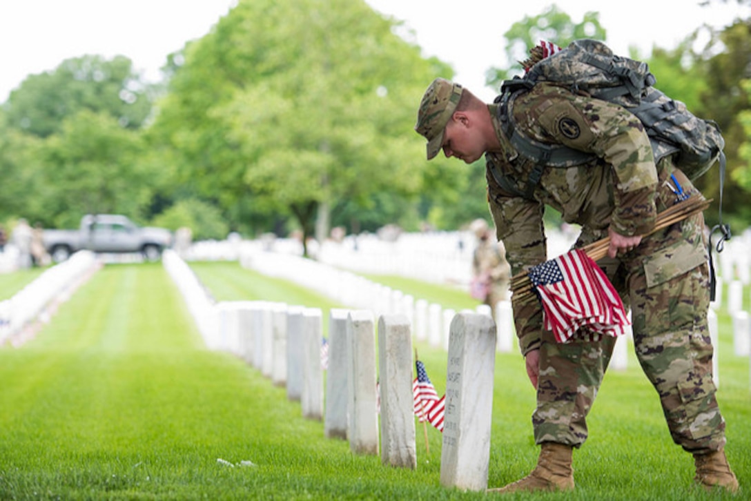 Soldiers from the 3rd U.S. Infantry Regiment, "The Old Guard," participate in the 'Flags In' mission at Arlington National Cemetery, Va. May 25, 2017. Soldiers placed an American flag at every grave maker in the cemetery. The Old Guard has conducted this mission annually at Arlington National Cemetery prior to Memorial Day. Army photo by Sgt. Nicholas T. Holmes