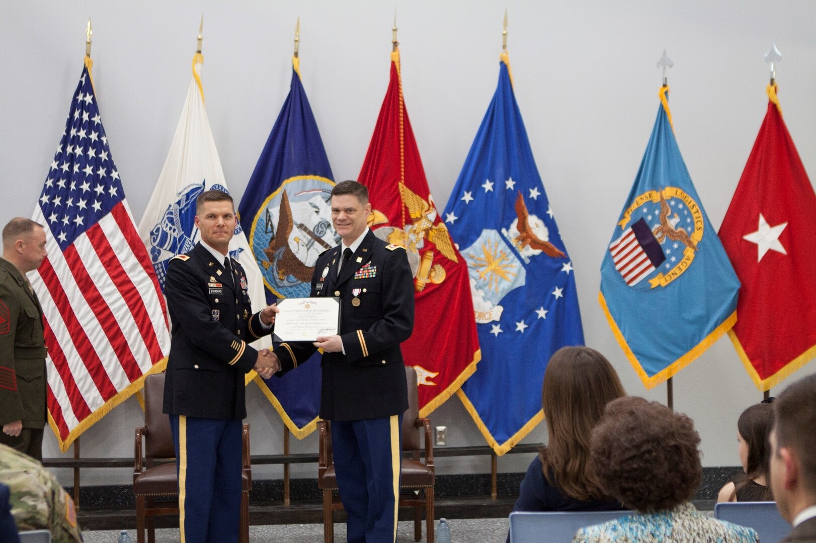 Army Col. Brad Eungard presented Army Lt. Col. Jacob H. Freeman with the Defense Meritorious Service Medal for his service at DLA Distribution, Susquehanna.