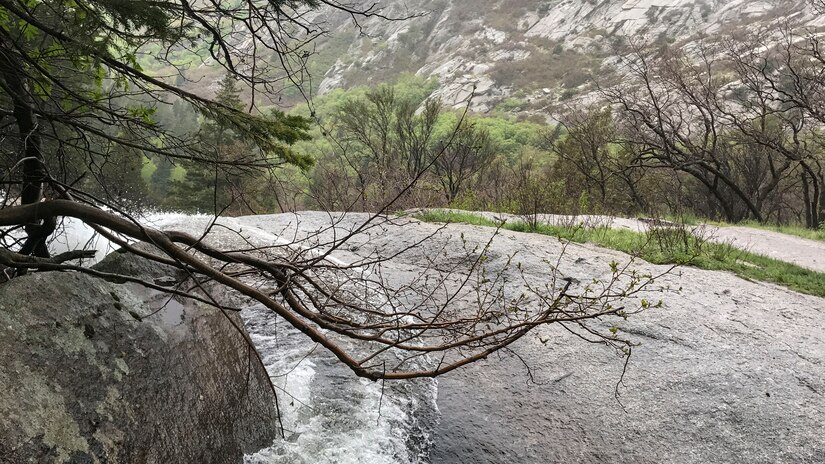 A view of Bells Canyon Creek dropping over Lower Falls in the background. The photo was taken May 21 after Tech. Sgt. Alister Clyne pulled Marco Mora-Huizar from the fast-moving creek. (Courtesy photo)