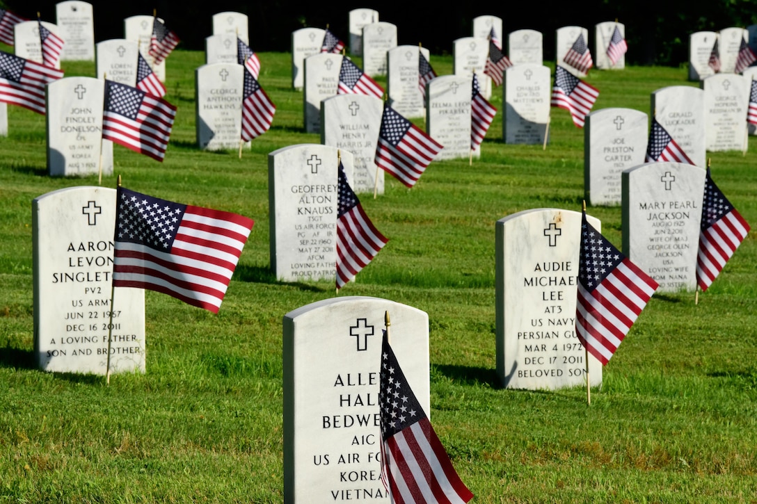American flags adorn headstones at the Arkansas State Veterans Cemetery following a Memorial Day flag placement ceremony conducted by airmen assigned to the Arkansas National Guard's 189th Airlift Wing in North Little Rock, Ark., May 24, 2017. Army National Guard photo by Spc. Stephen Wright