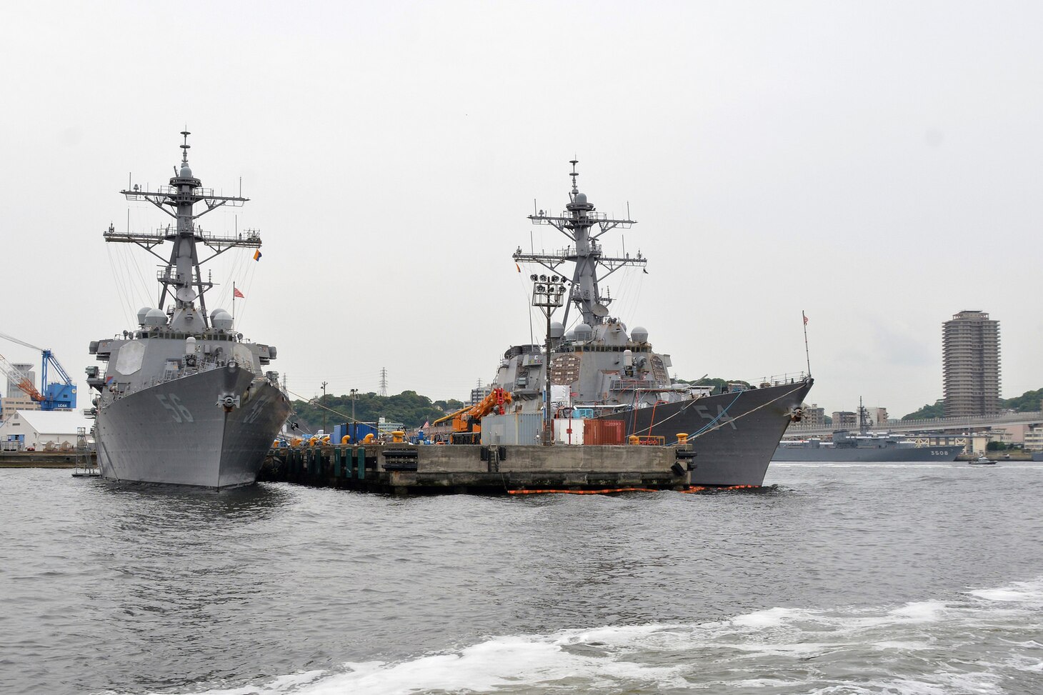 The Arleigh-Burke-class guided-missile destroyers USS John S. McCain (DDG 56) and USS Curtis Wilbur (DDG 54) sit pier-side at Fleet Activities (FLEACT) Yokosuka, May 16, 2017. FLEACT Yokosuka provides, maintains, and operates base facilities and services in support of 7th Fleet's forward-deployed naval forces, 71 tenant commands, and 26,000 military and civilian personnel. 